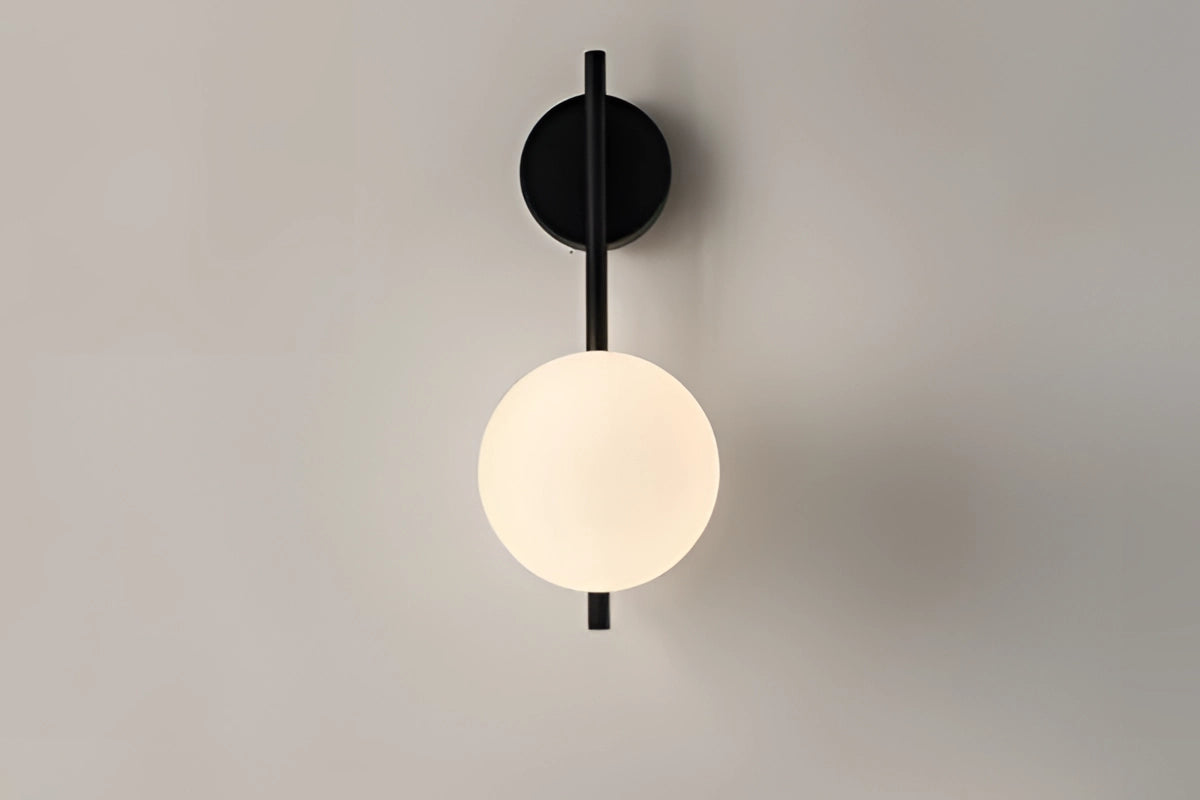 Modern dual globe brass wall sconces featuring a minimalistic design with circular shades, showcasing a sleek metallic finish and symmetrical structure, ideal for contemporary lighting decor.