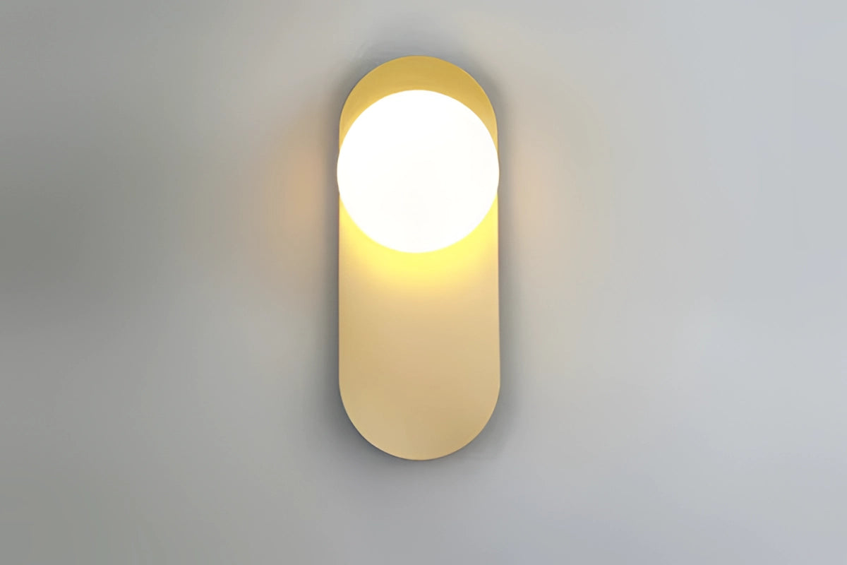 Modern dual globe brass wall sconces featuring minimalistic design with two spherical amber-tinted glass shades, mounted on a sleek brass fixture, providing stylish and elegant lighting decor.