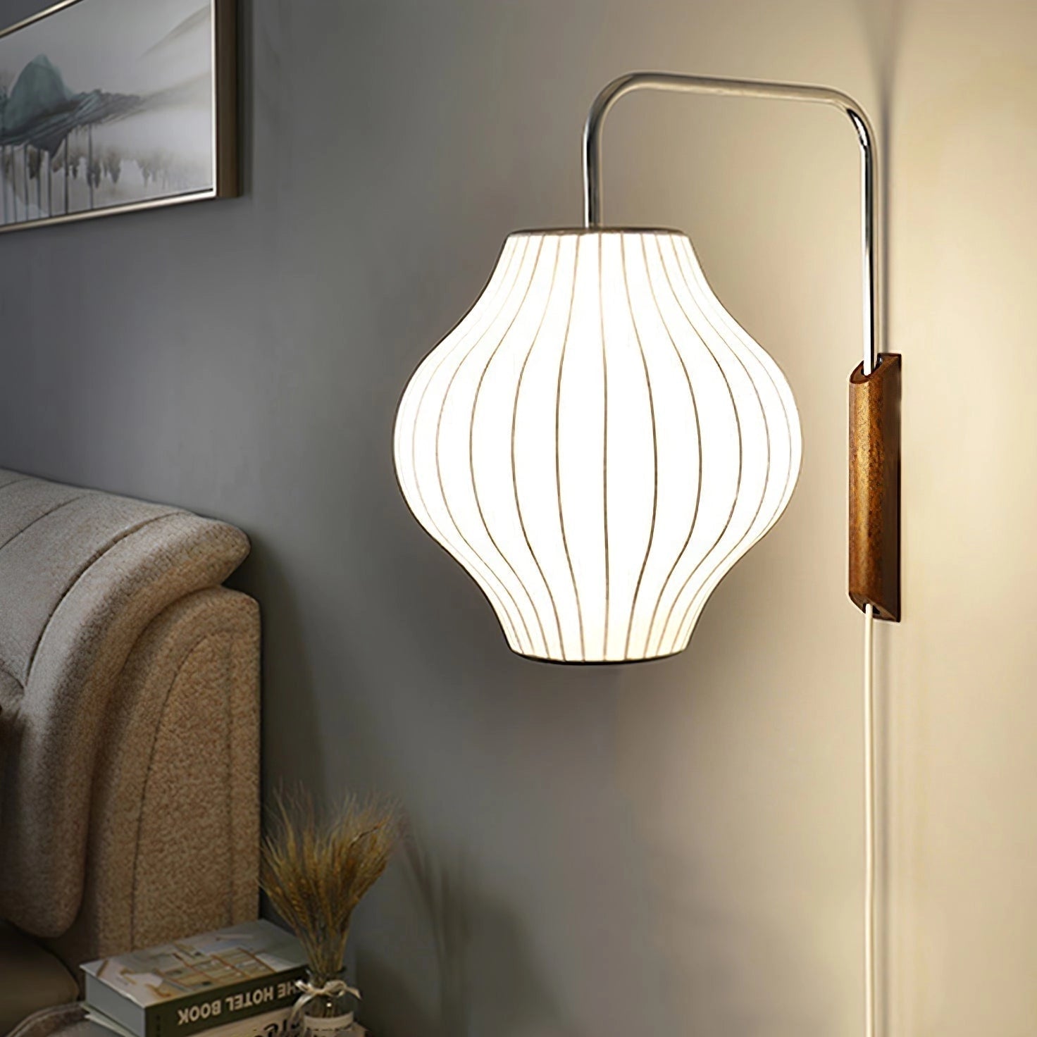 A minimalist modern floor lamp featuring adjustable brass and wood accents, with a rectangular textile lampshade, designed to enhance interior design aesthetics.