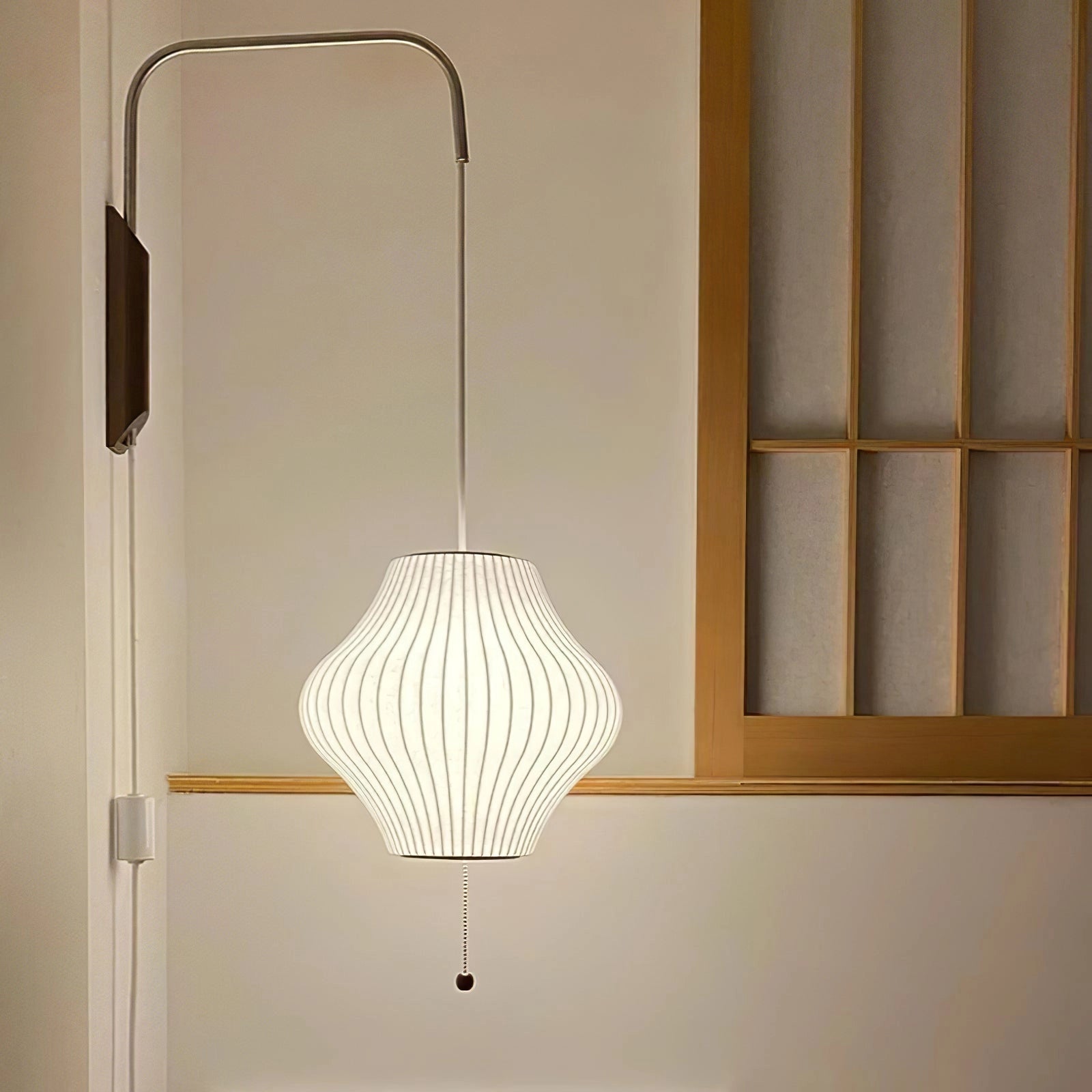 Modern floor lamp featuring a minimalist design with adjustable brass and wood accents, rectangular shade, suitable for interior design settings.