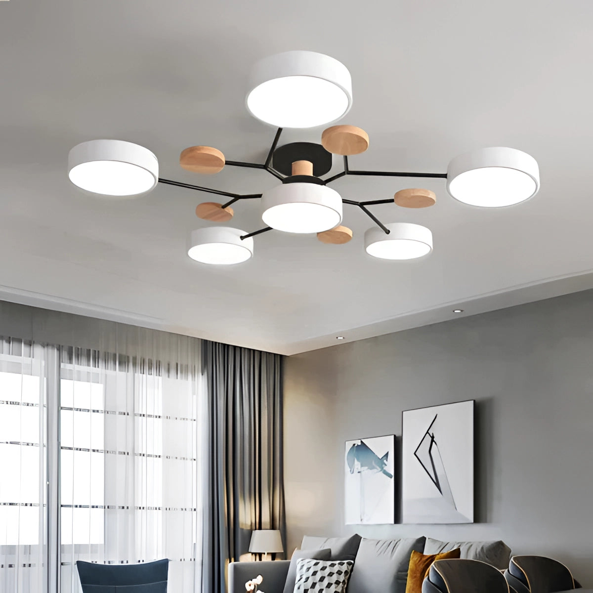 Modern geometric chandelier with a matte black and wood finish, featuring multiple bulbs, elegantly suspended from the ceiling in a contemporary interior setting.