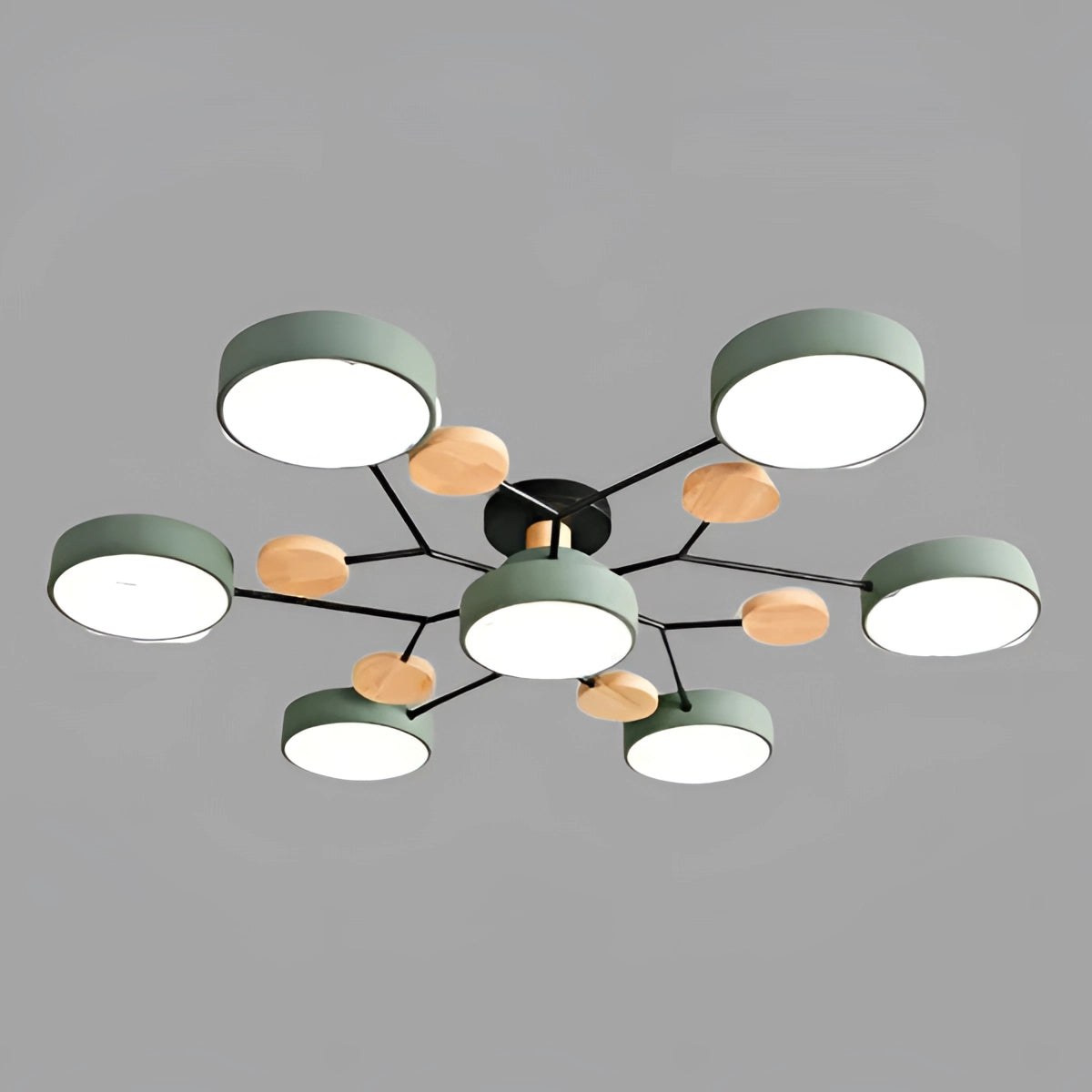 Modern geometric chandelier featuring a matte black and wood design, with multiple bulbs arranged in a circular pattern, hanging from the ceiling. The overall aesthetic includes green accents, creating a contemporary and artistic look.