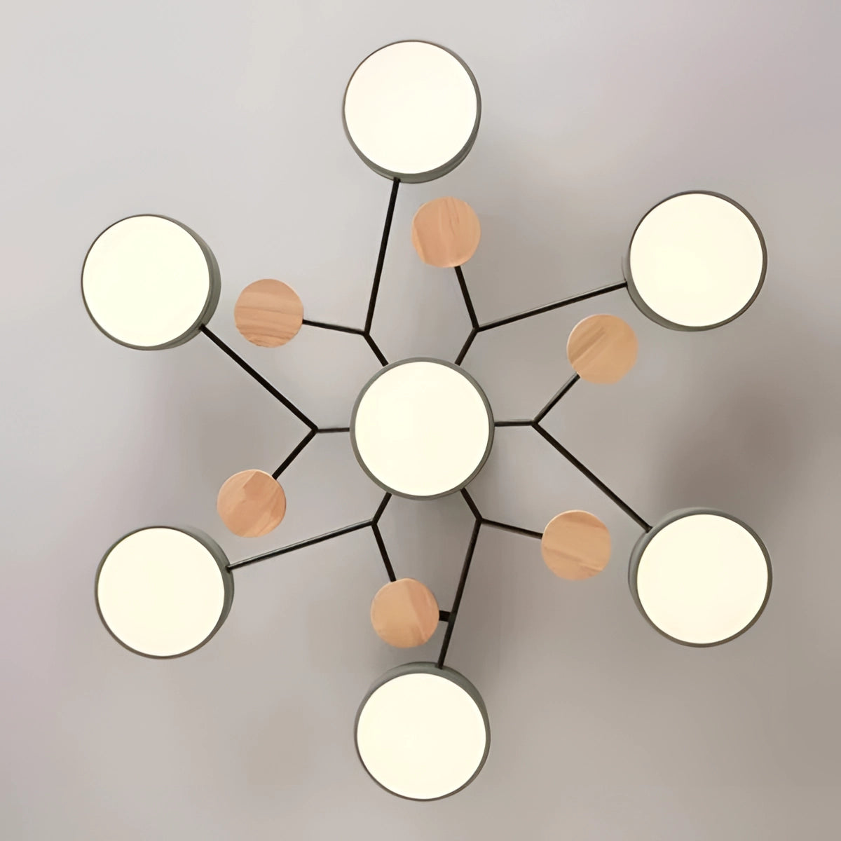 Modern geometric chandelier featuring a matte black and wood finish, showcasing a multi-bulb design with a stylish pattern of intersecting lines and circles, hanging from the ceiling with an artful and contemporary aesthetic.