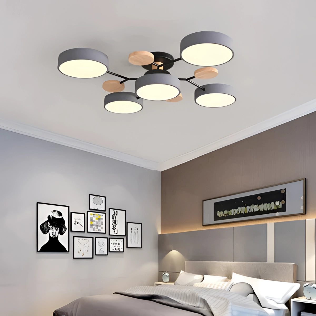 Modern geometric chandelier with a matte black metal frame and wood accents, featuring multiple bulbs, hanging in an elegantly designed interior space.