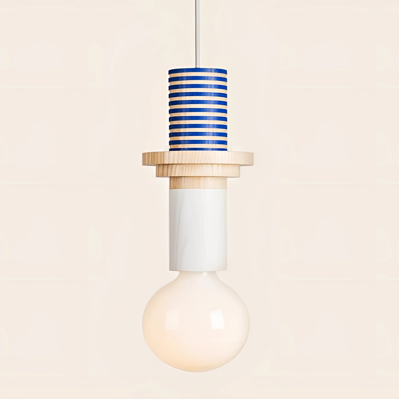 Modern geometric LED pendant light featuring colorful wood blocks with blue stripes, suspended from the ceiling.