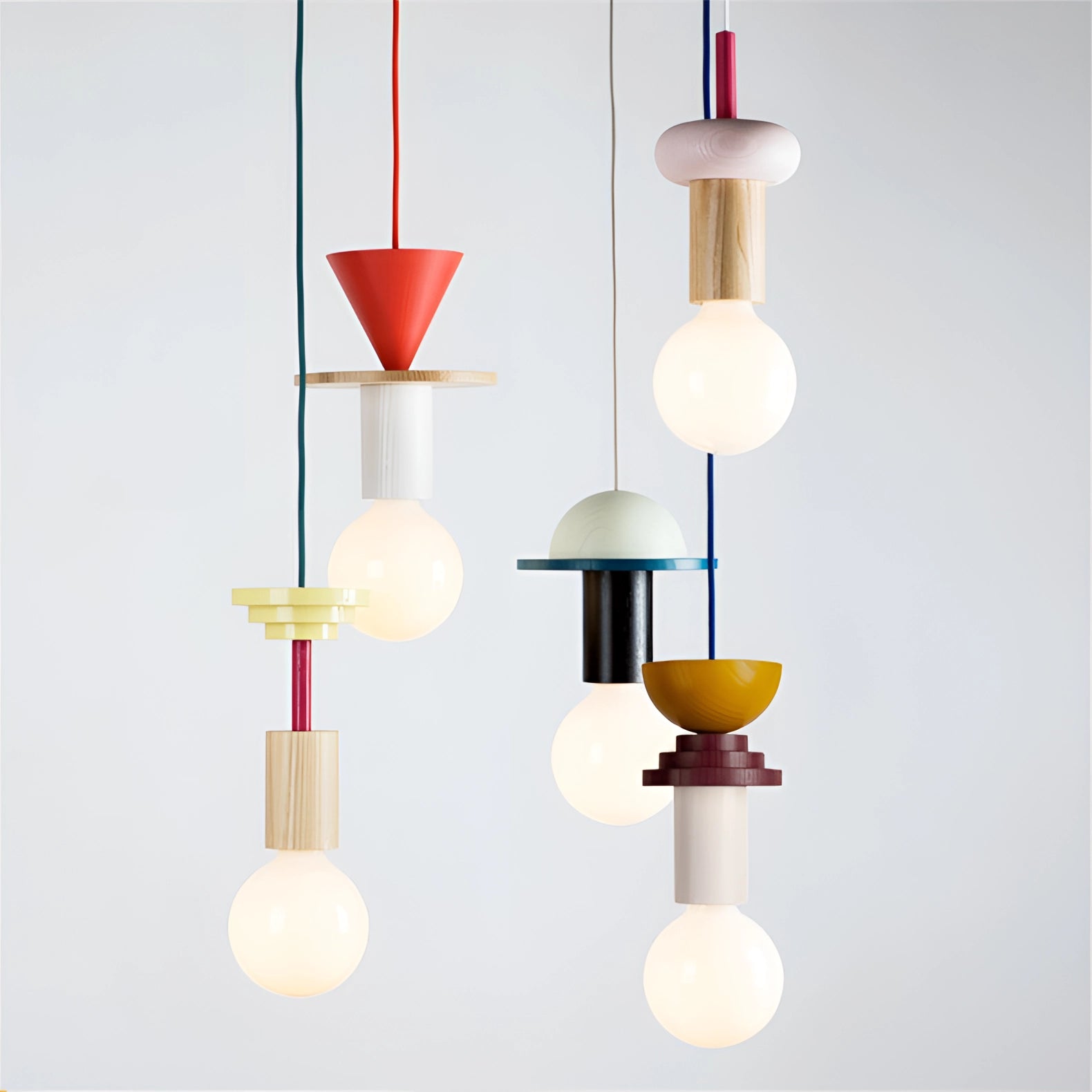 Modern geometric LED pendant light featuring colorful wood block design, hanging from ceiling with a circular pattern.