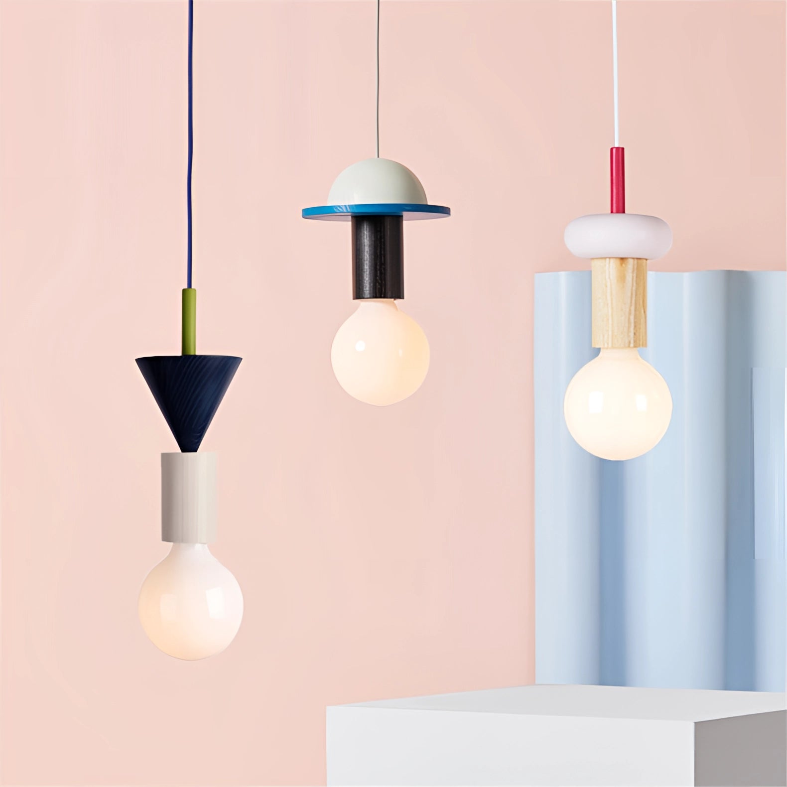 Modern geometric LED pendant light with colorful wood blocks hanging from the ceiling, featuring artistic design and tints and shades.