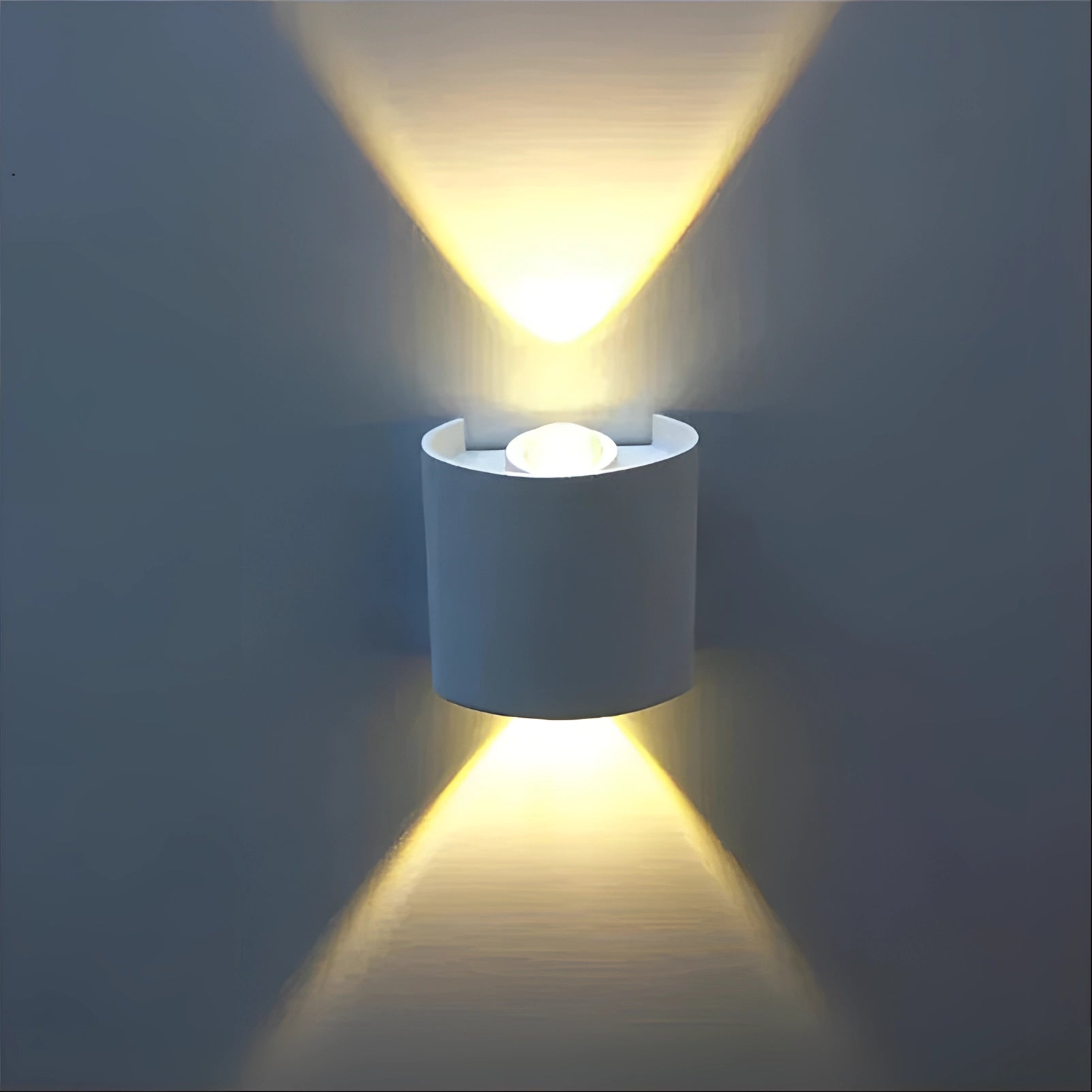 Modern geometric LED wall sconce with a circular design, featuring a sleek electric blue finish, mounted on a wall, providing ambient lighting.