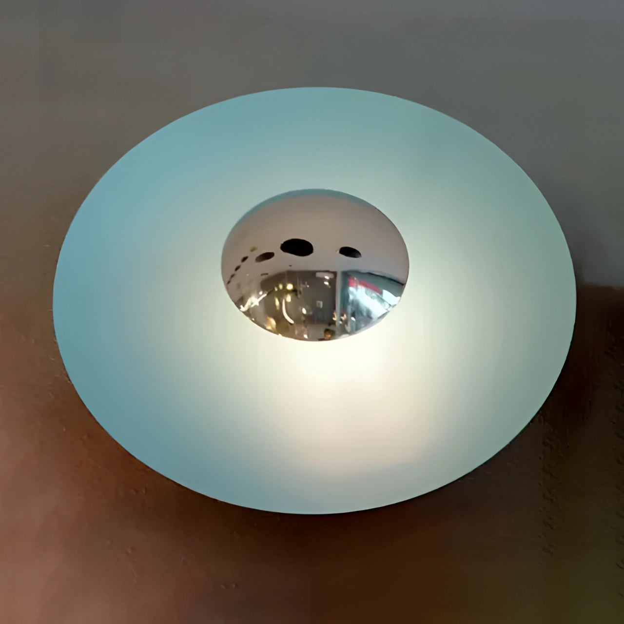 Modern LED wall lamp featuring a minimalistic brass decorative sconce with a circular design, shown in a blue finish with silver accents, measuring 60cm in length. The lamp emits cold white light and is crafted with metal elements, suitable for contemporary interior spaces.