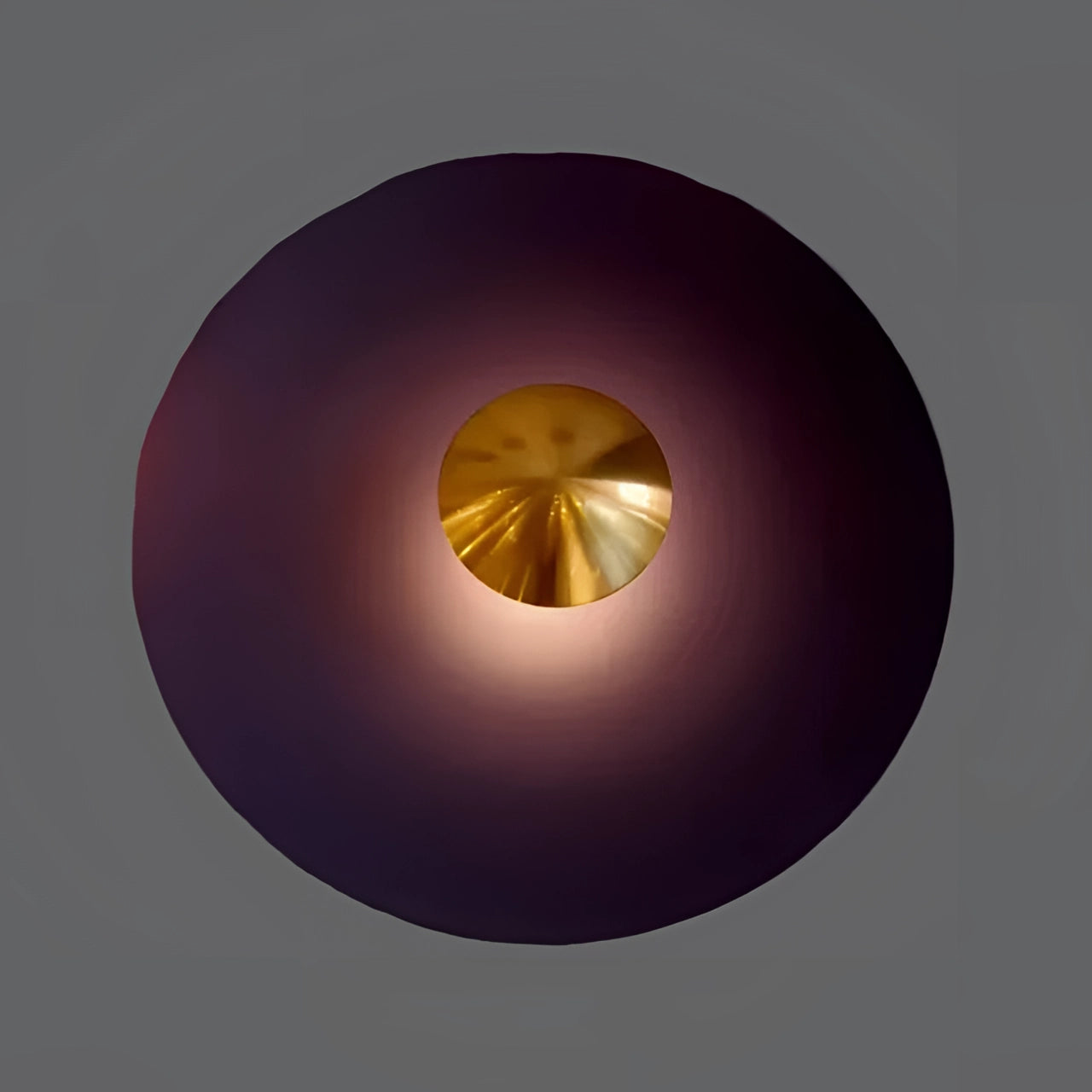 Modern LED wall lamp in a minimalistic design featuring a brass decorative sconce. The lamp is violet with gold accents, measures 60cm, and emits a cold white light. The fixture has a symmetrical circular shape and is crafted from metal, offering a contemporary and stylish addition to interior spaces.