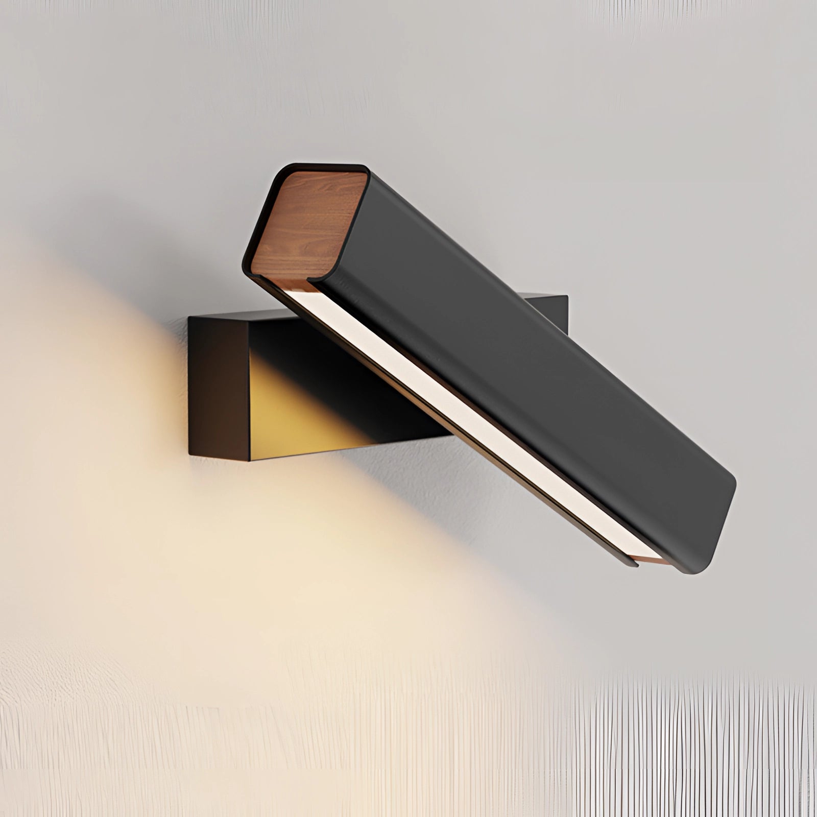 Modern LED wall sconce with a rectangular black and gold design, featuring contemporary metal and wood elements, suitable for stylish home decor.