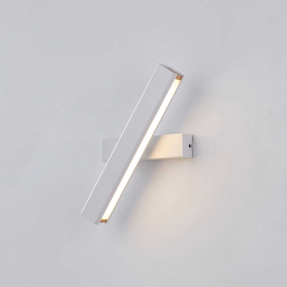 Modern LED wall sconce featuring a sleek black and gold design, mounted on a wall with a focus on the contemporary adjustable lamp, showcasing its metal and composite material construction.