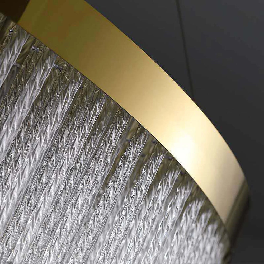 A modern luxury circular LED chandelier with a crystal design and brass finish, featuring a sleek and elegant appearance.