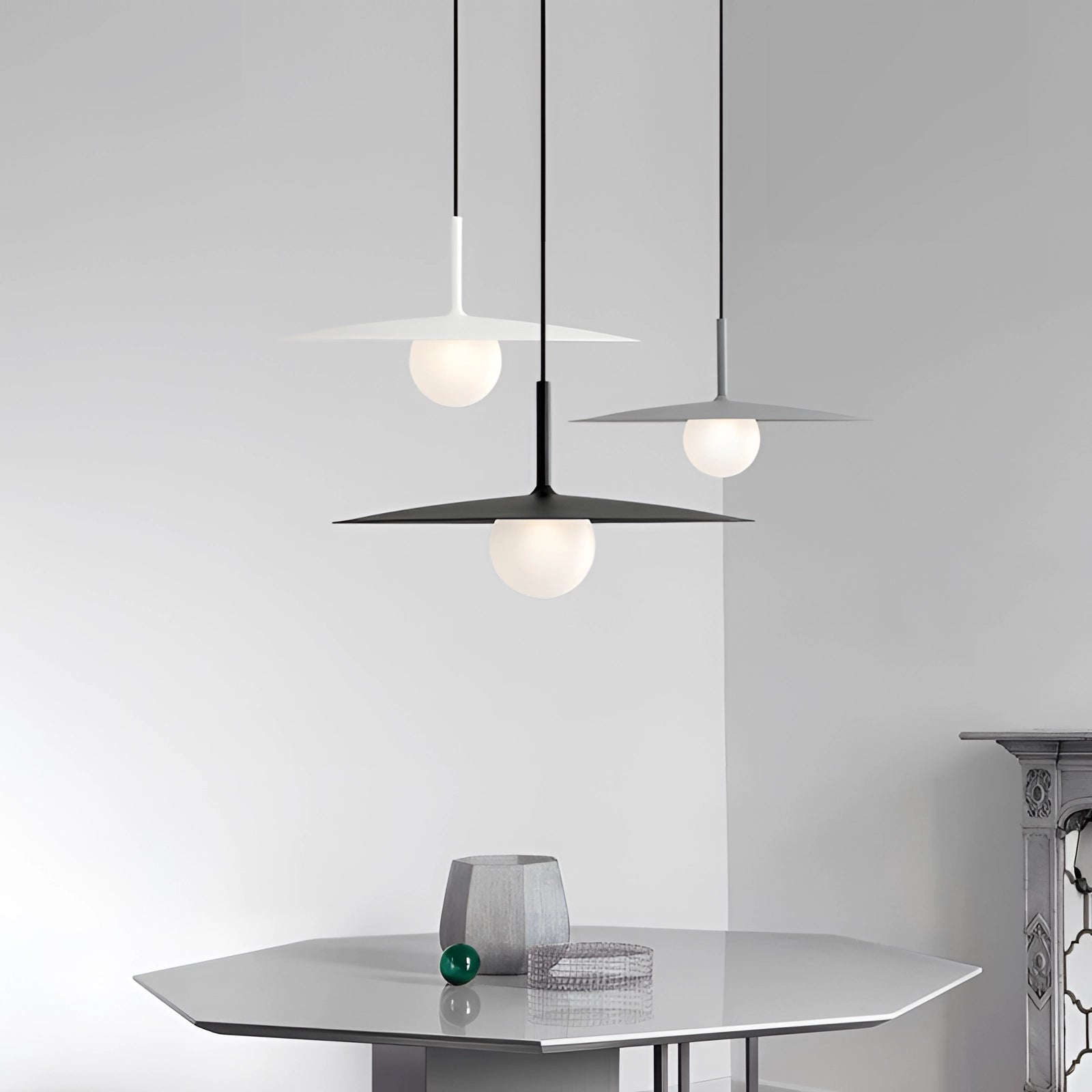 Modern minimalist LED pendant light with a Scandinavian dual-tone design, featuring a sleek metal and wood combination, suspended from the ceiling, casting a warm ambient glow over a table.