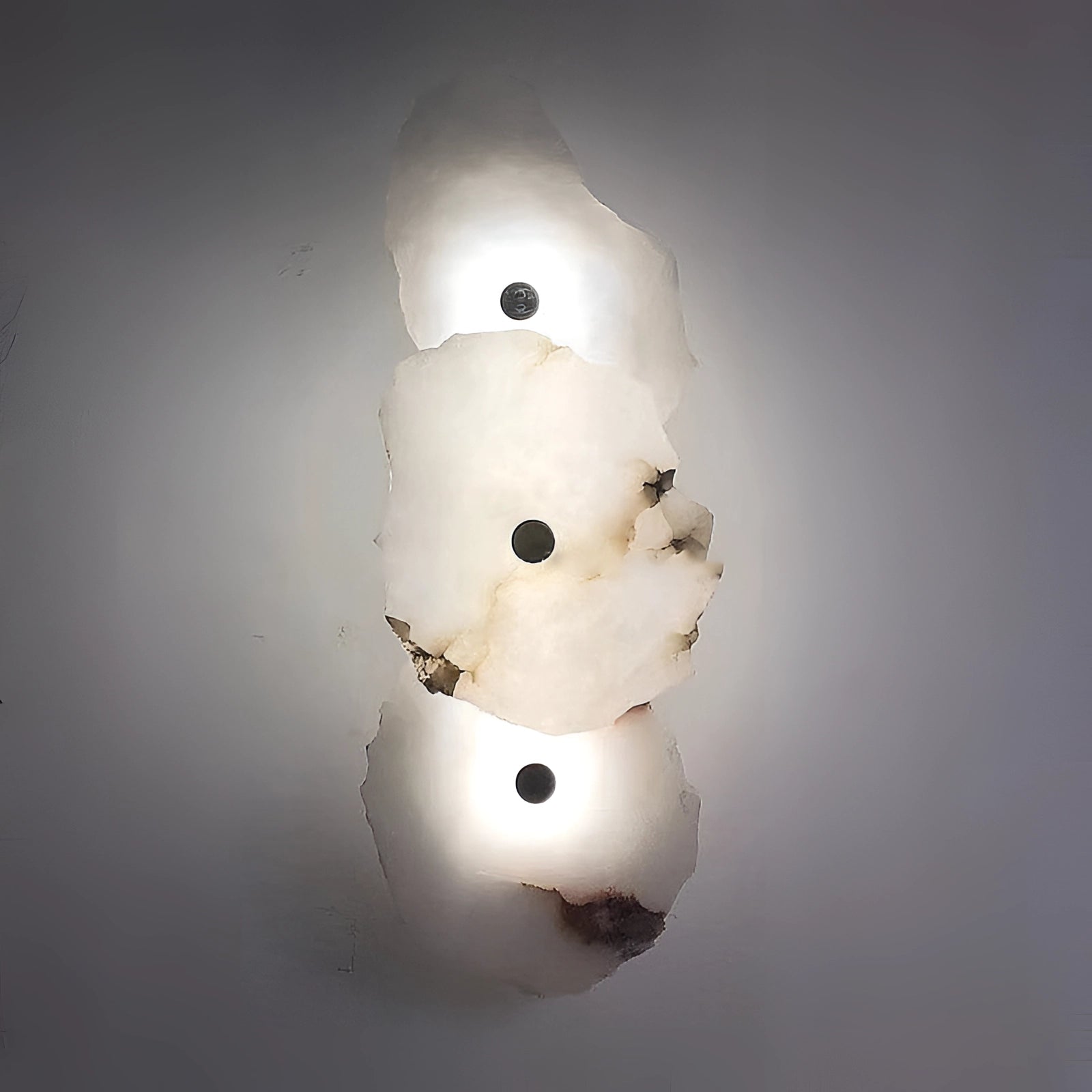 Modern minimalist LED wall lamp with a unique design, featuring a sleek, geometric appearance that casts ambient light; suitable for installation in Great Britain or Australia with a voltage of 220 V-240 V. The lamp has an artistic and playful aesthetic reminiscent of abstract art.