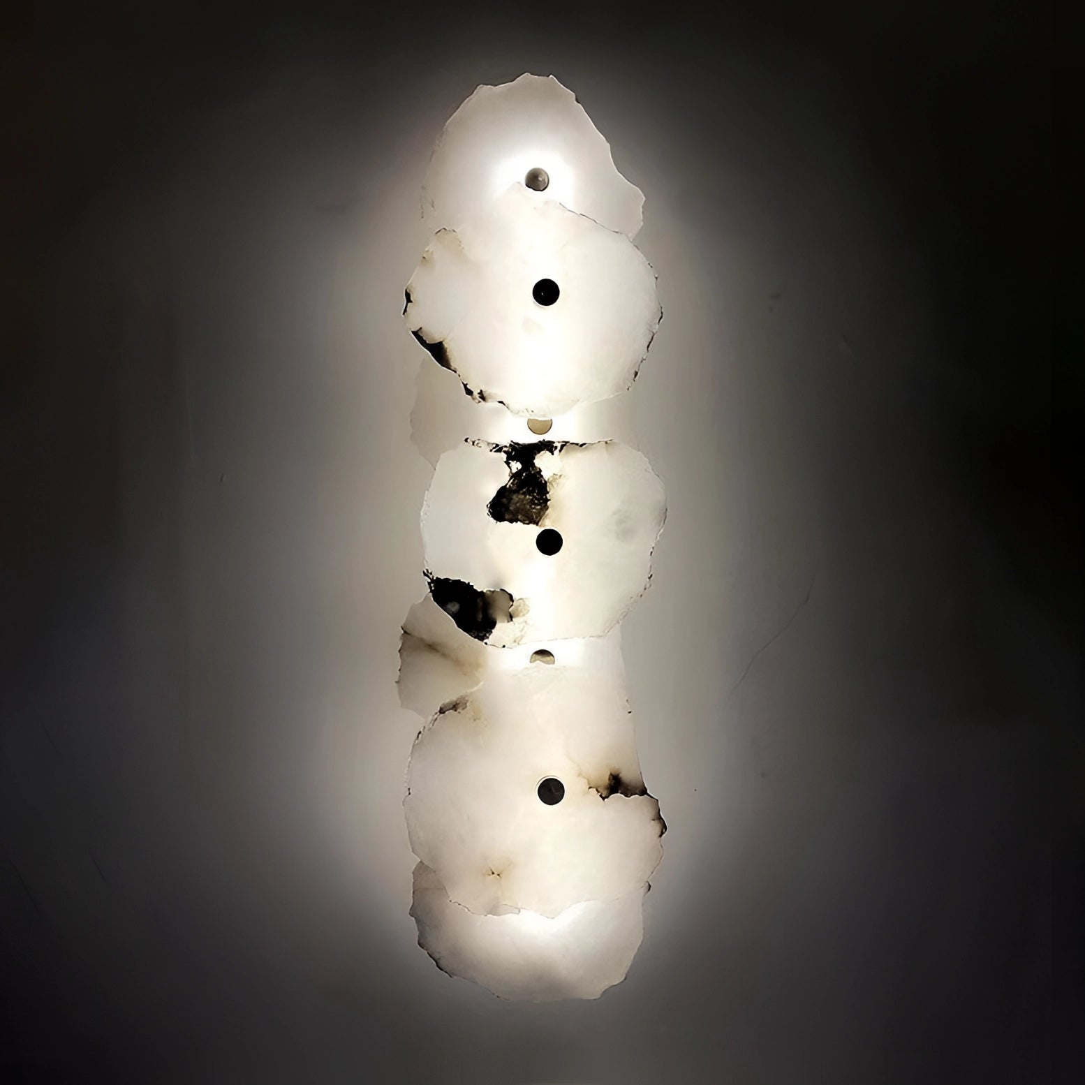 Modern minimalist LED wall lamp with a unique circular design, featured in a monochrome setting, suitable for ambient lighting in Great Britain or Australia with a voltage range of 220 V-240 V.