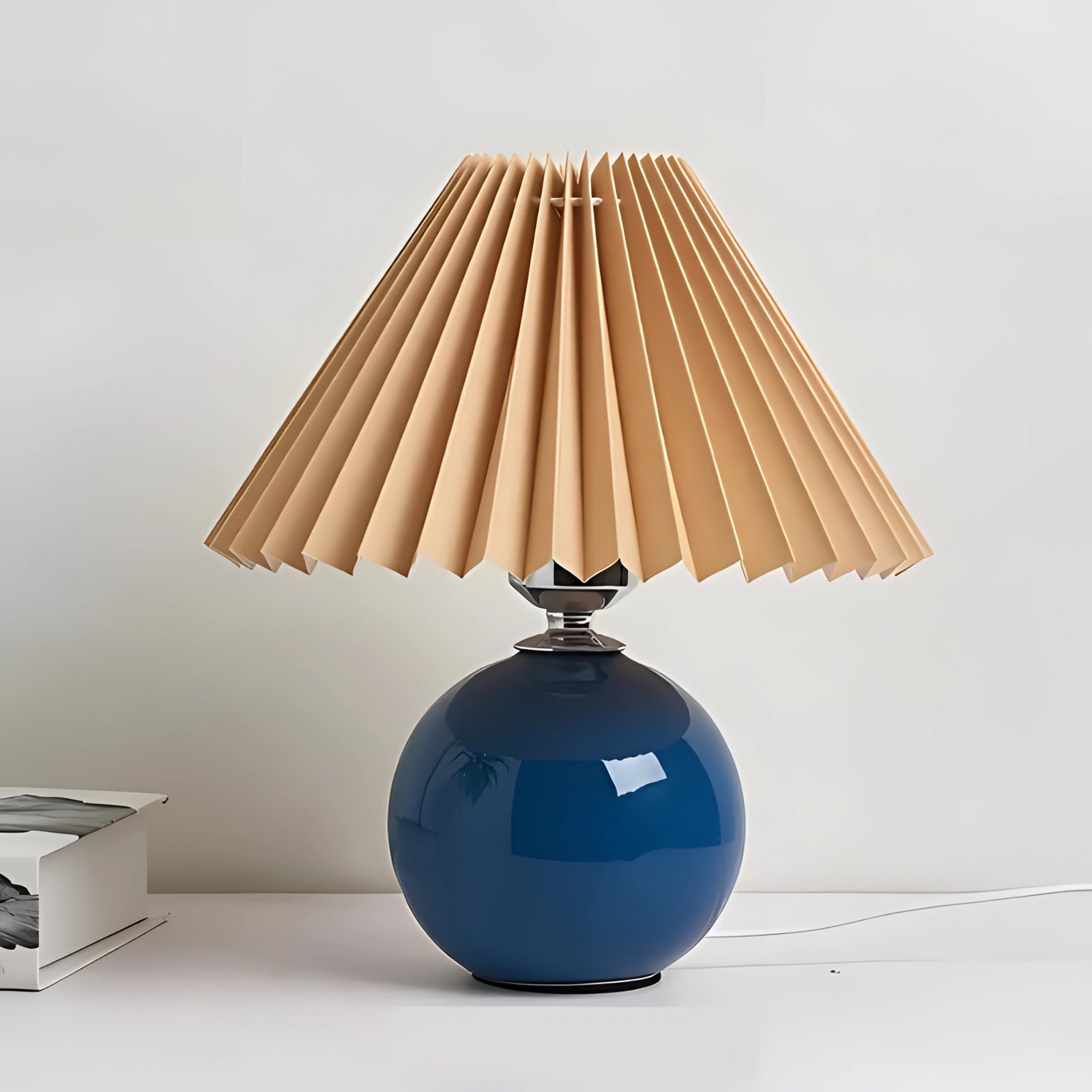 Modern pink ceramic lamp with a pleated shade, featuring Scandinavian design elements, displayed in a variant with brown and blue tones, highlighting its artistic and stylish appeal.