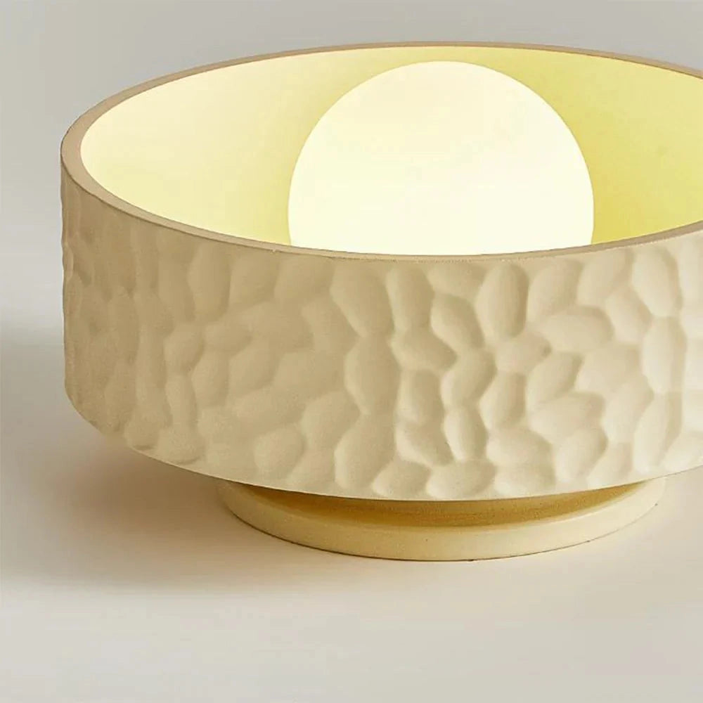 Modern textured circular LED ceiling light fixture with a flush mount design, featuring a contemporary artistic style with a natural material finish.