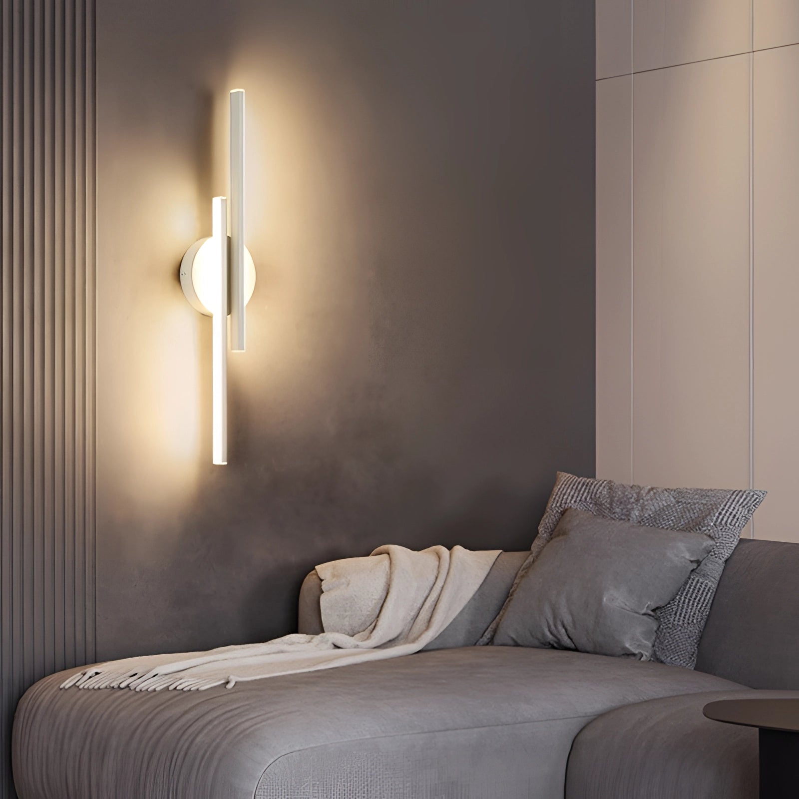 Modern black circular minimalist LED wall sconce mounted on a wall, featuring a sleek design ideal for contemporary interior settings, with a focus on lighting and architectural aesthetics.