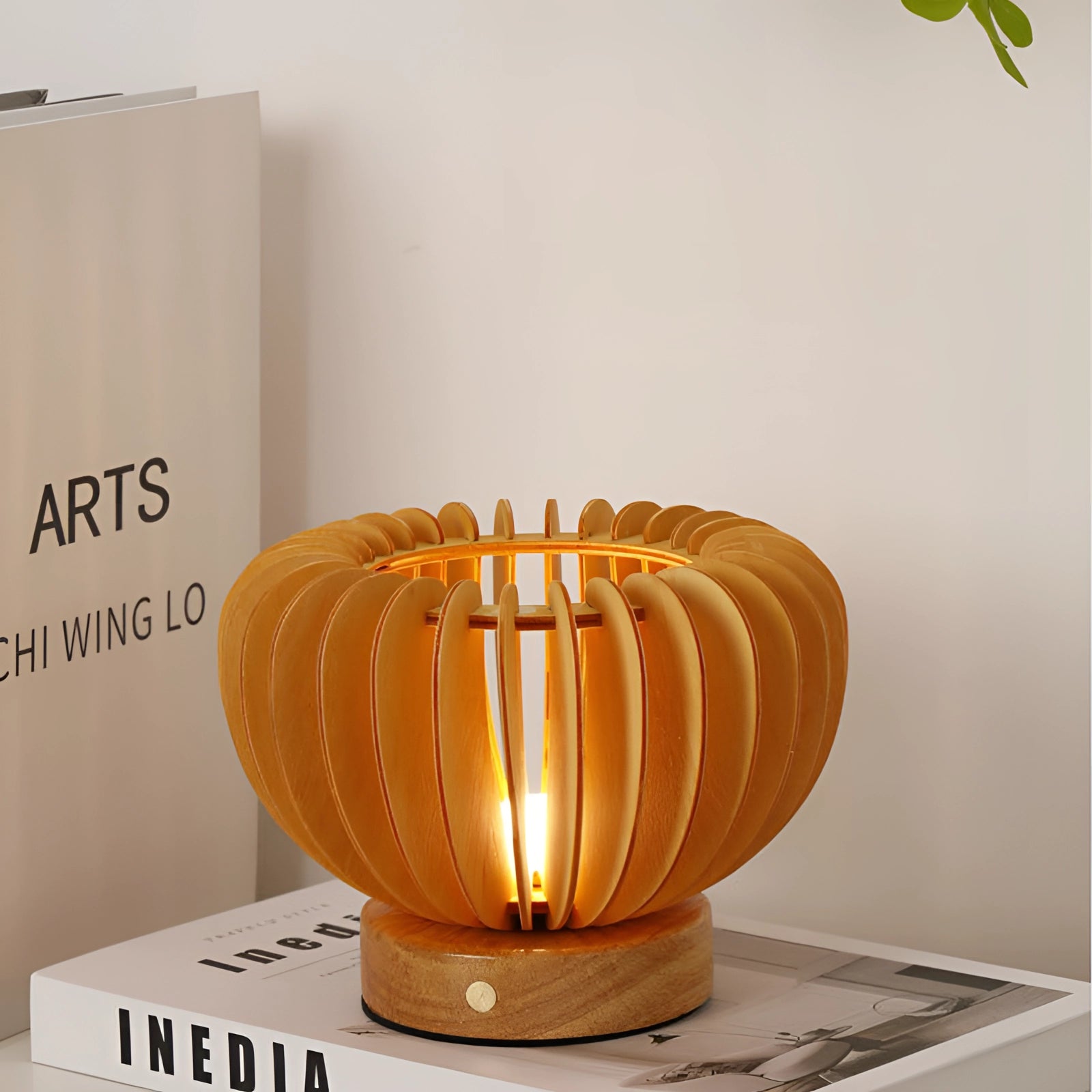 Nordic wooden pumpkin decor with a minimalist Scandinavian design, featuring smooth orange wood with subtle line details, ideal as an autumn centerpiece on a table.