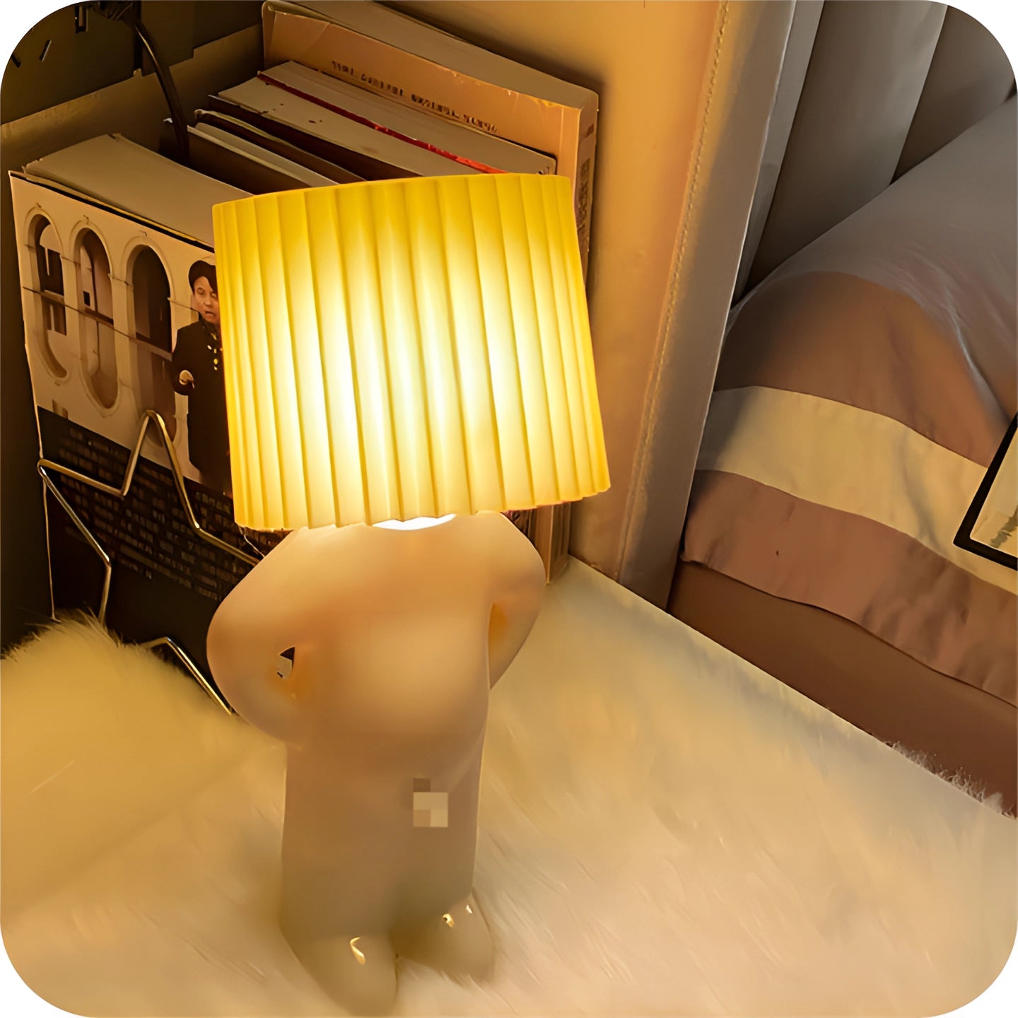 Human-shaped novelty table lamp with a wooden base, featuring a rectangular design. The lamp is a quirky designer accent piece suitable for room decor, showcasing artistic flair and unique lighting accessory aesthetics.
