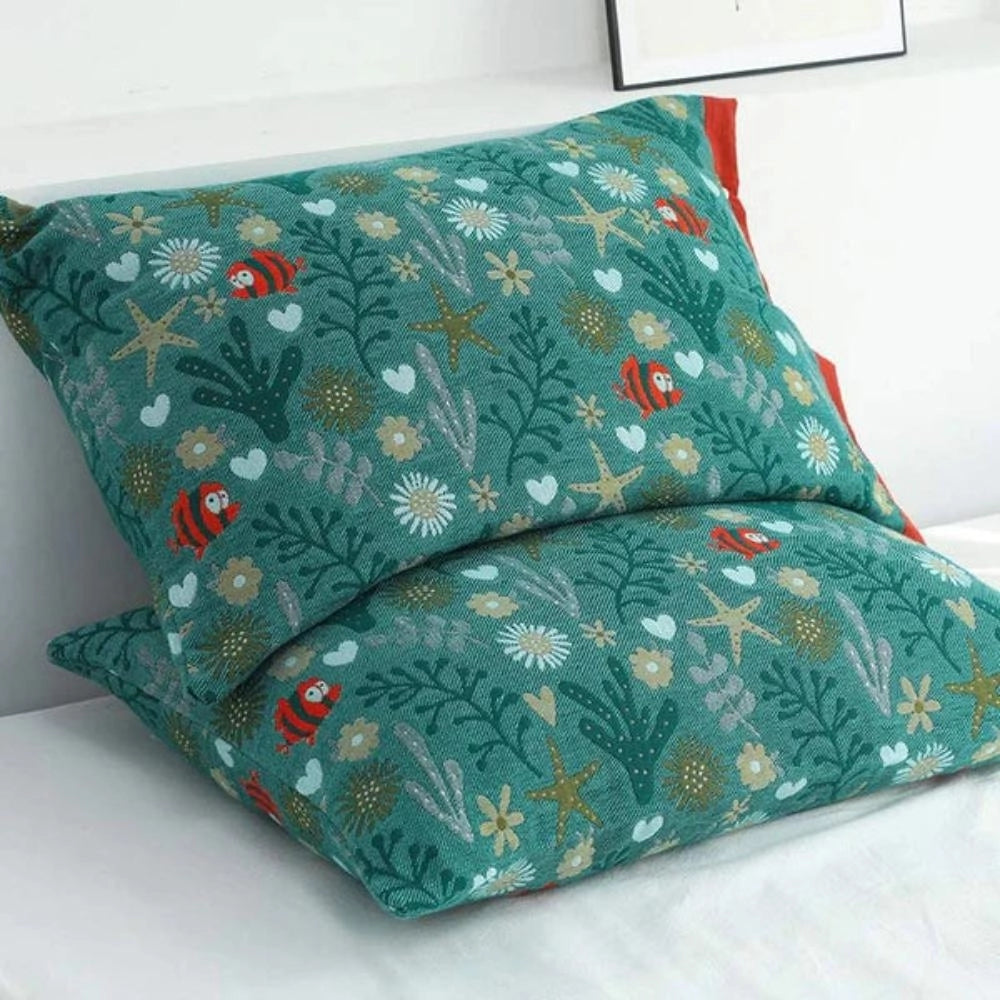 Ocean-themed rectangle throw pillow with a vibrant green and blue coral and fish motif, measuring 52cm by 80cm, ideal for nautical home decor.