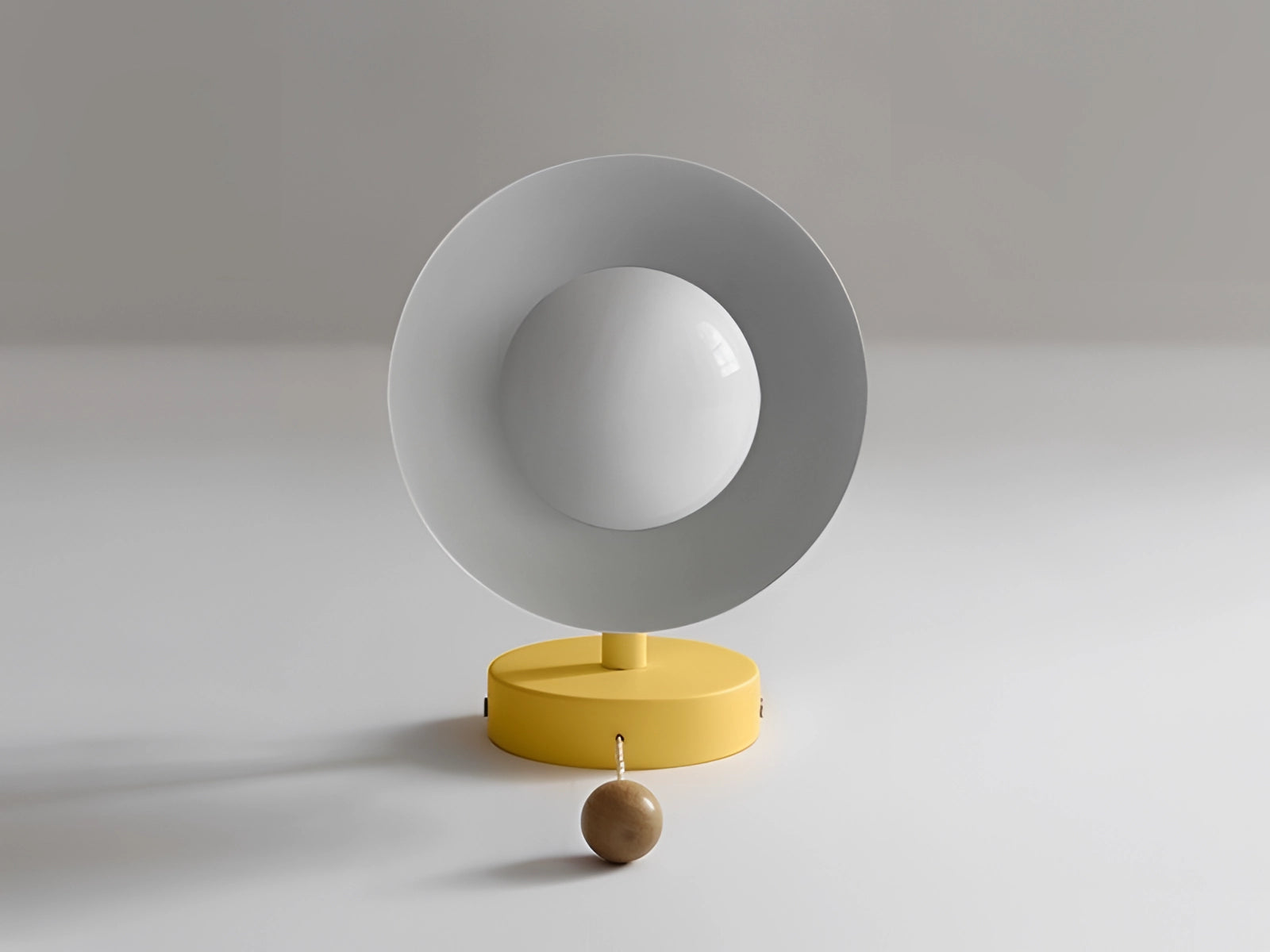 Minimalist pastel Scandinavian adjustable wall lamp with a color block design, featuring a circular metal sconce, mounted on a ceiling.