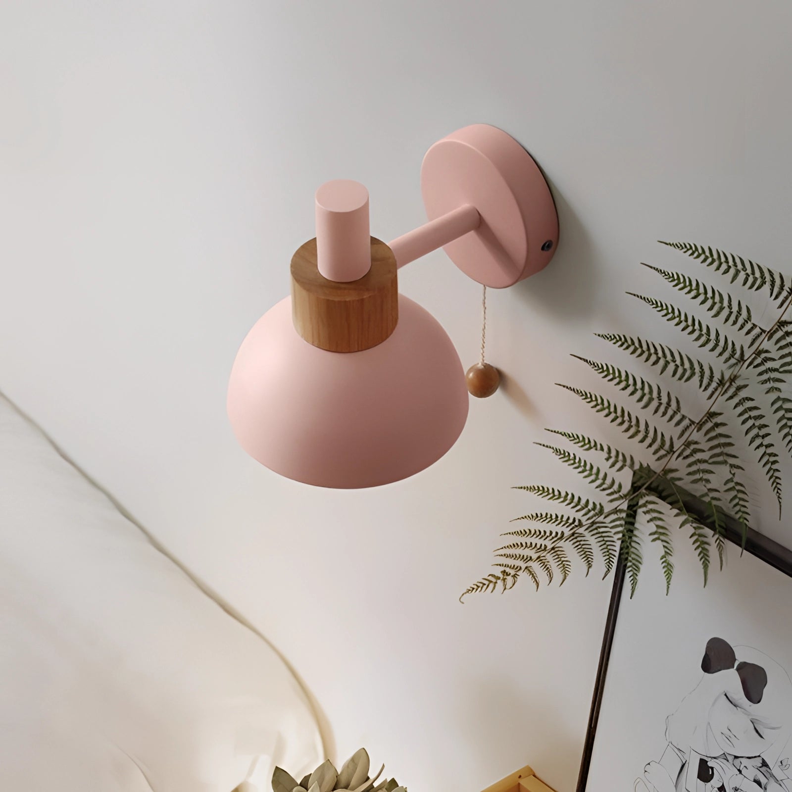 Pastel Scandinavian adjustable wall lamp with a minimalist color block design, featuring wood and pink accents.