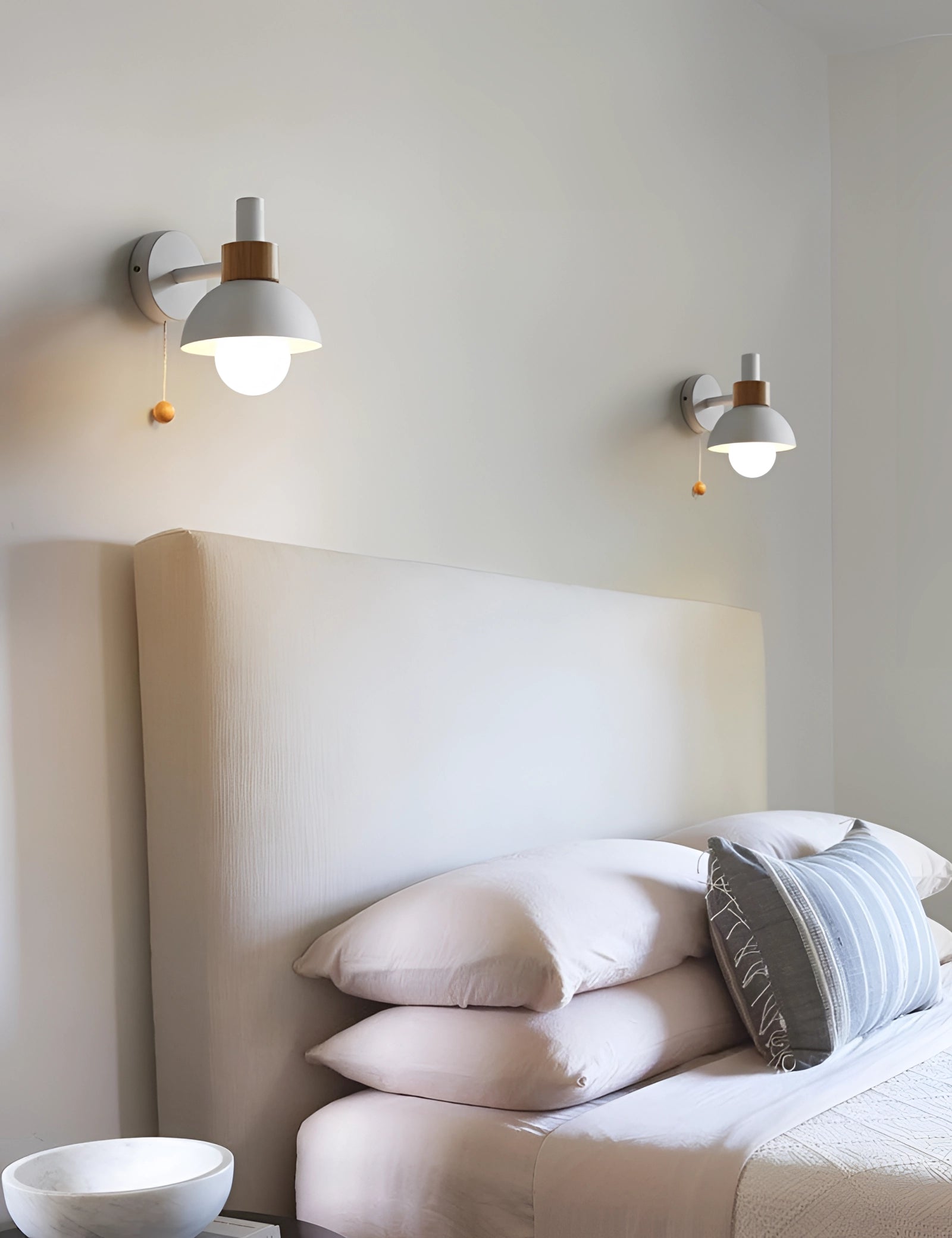 Minimalist pastel Scandinavian adjustable wall lamp with color block design, mounted on a wooden wall plaque, emitting soft lighting, enhancing interior design with modern and comfortable aesthetics.