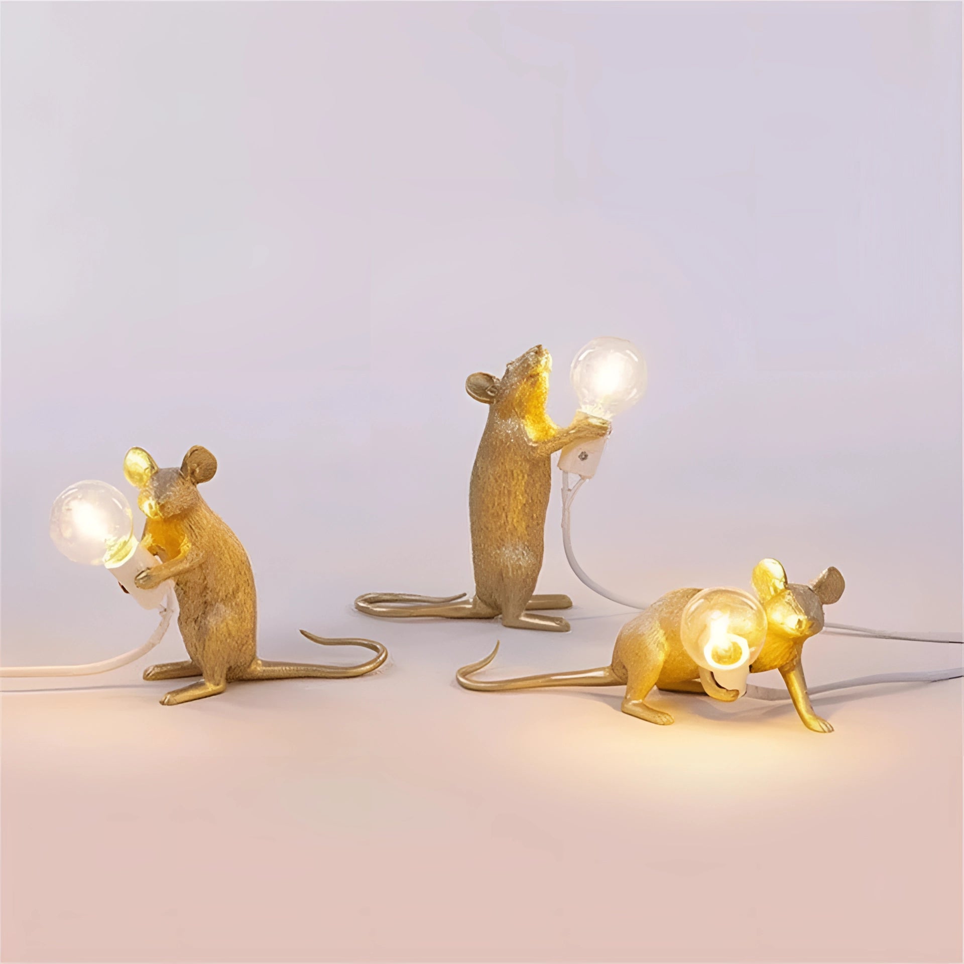 Black reclining rat-shaped table lamp with a push button, featuring a unique animal design with intricate details including a long tail, made from metal.