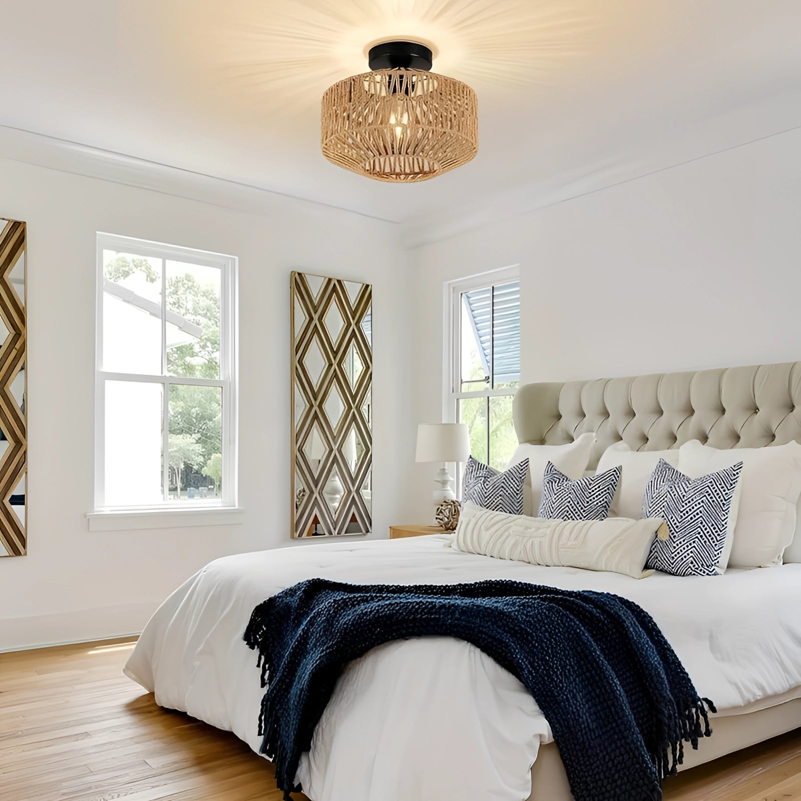 Rattan Bohemian flush mount light fixture hanging from the ceiling, featuring a natural wood texture and intricate woven design, adding a touch of eco-friendly elegance to the room with sunlight streaming through nearby windows and leafy green plants enhancing the cozy atmosphere.