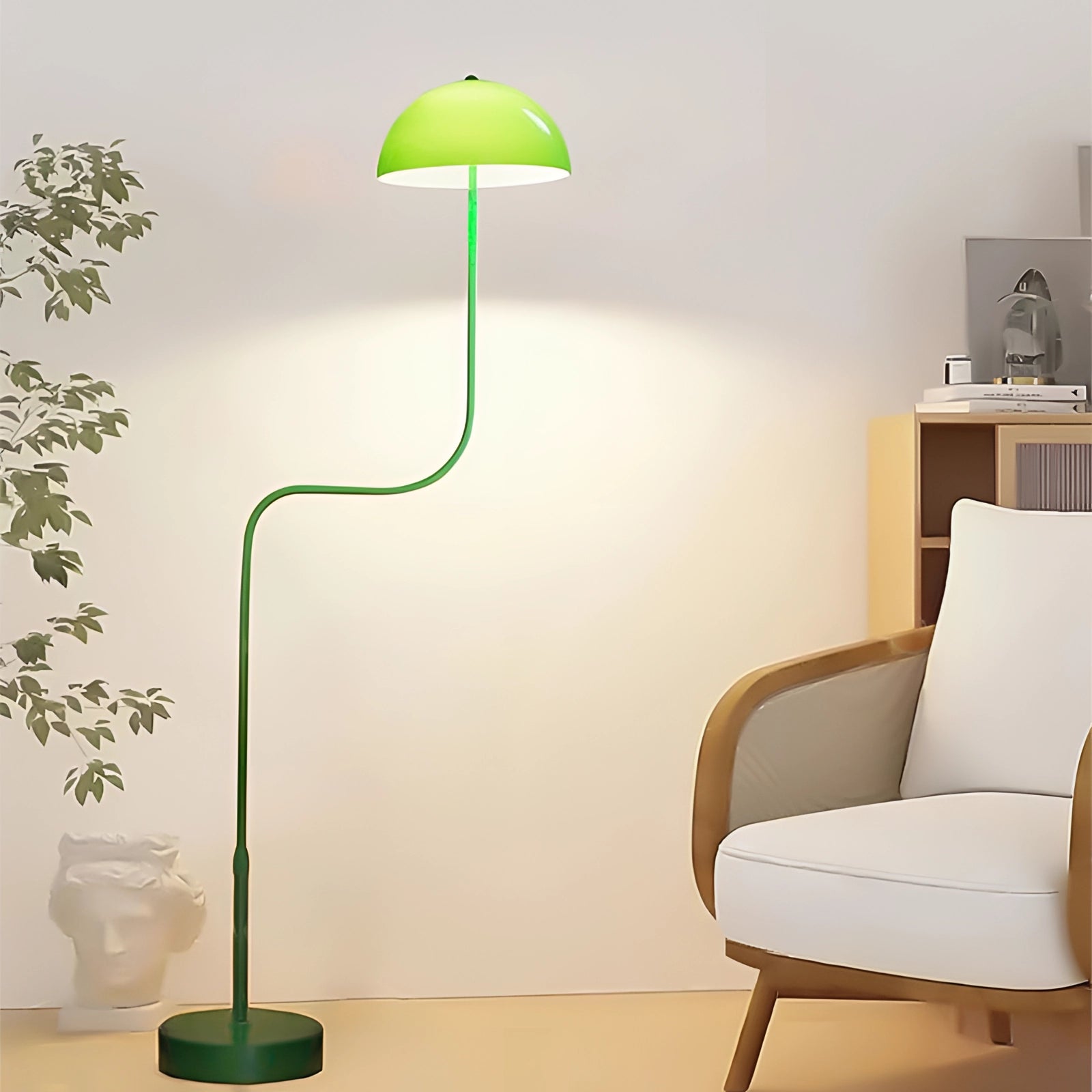 Elegant Retro Art Deco floor lamp with a green shade and brass stand, positioned in a stylish interior setting with wooden flooring and a plush chair nearby.