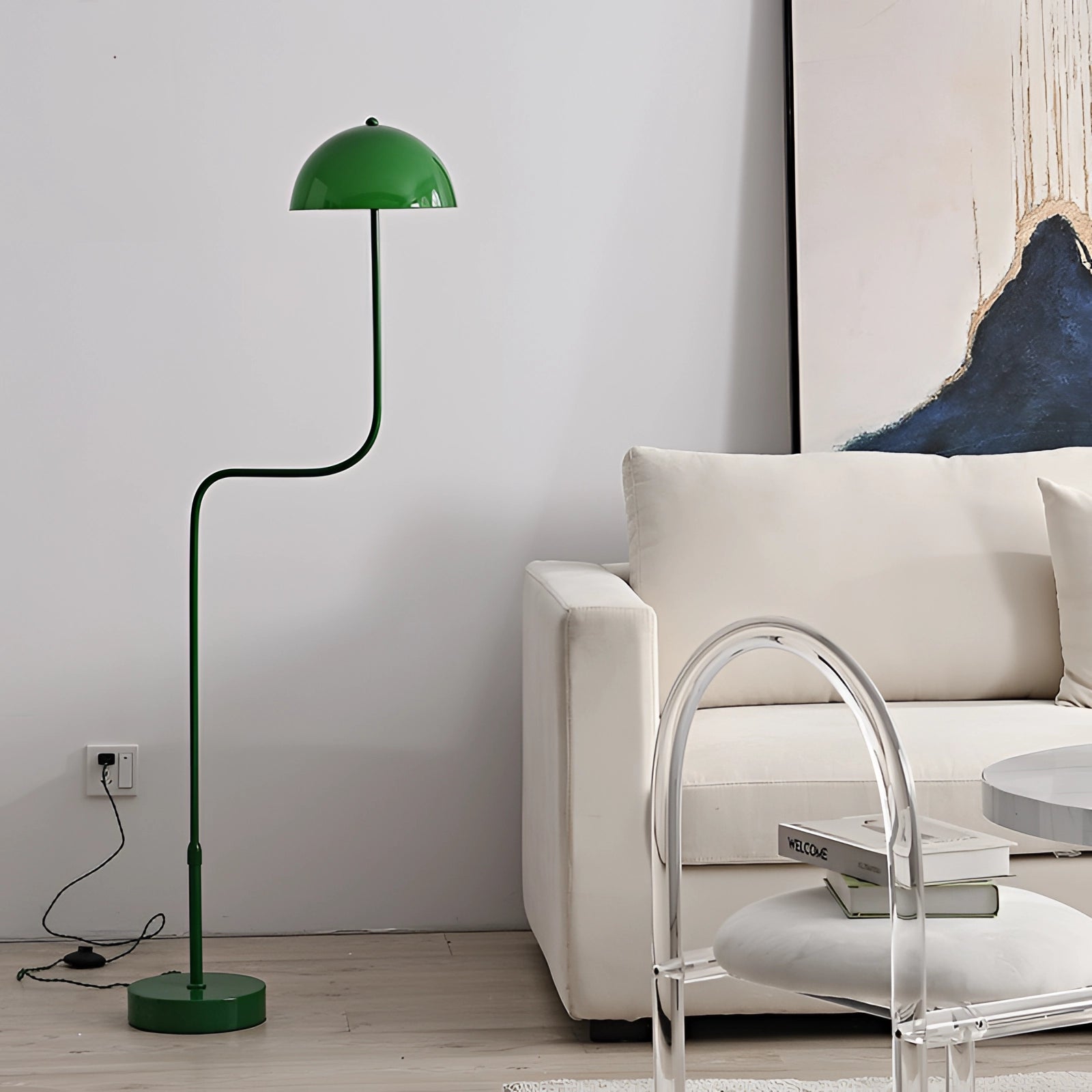 Elegant retro Art Deco green and brass floor lamp placed in a stylish interior setting with a wooden floor and white walls, enhancing the comfort and design of the room.