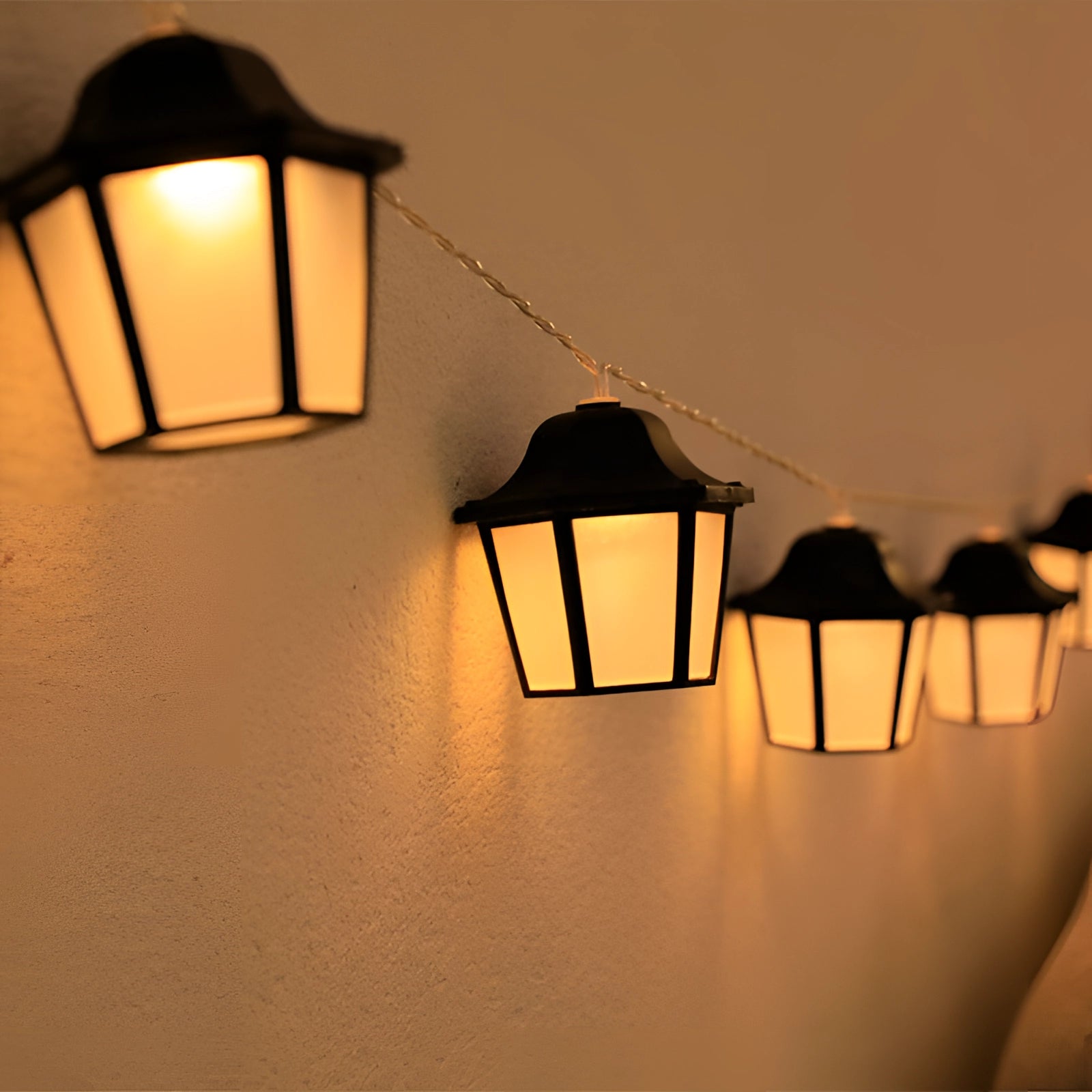 Retro Industrial Metal Cage String Lights with 20 amber LED bulbs, designed for outdoor use, featuring a 3-meter length and a weatherproof metal cage design suitable for creating a warm, vintage ambiance in outdoor settings.