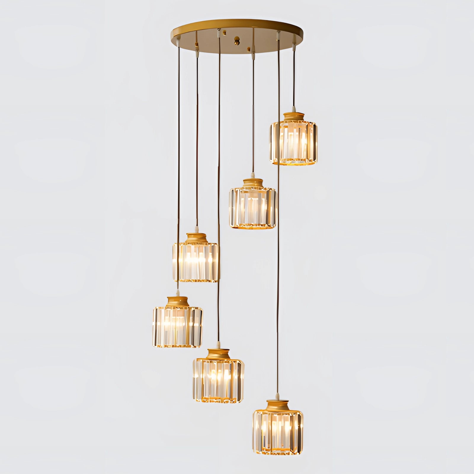 Ribbed glass multi-light pendant with six adjustable bronze clusters in a gold finish, featuring cylindrical shapes and a ceiling fixture design.