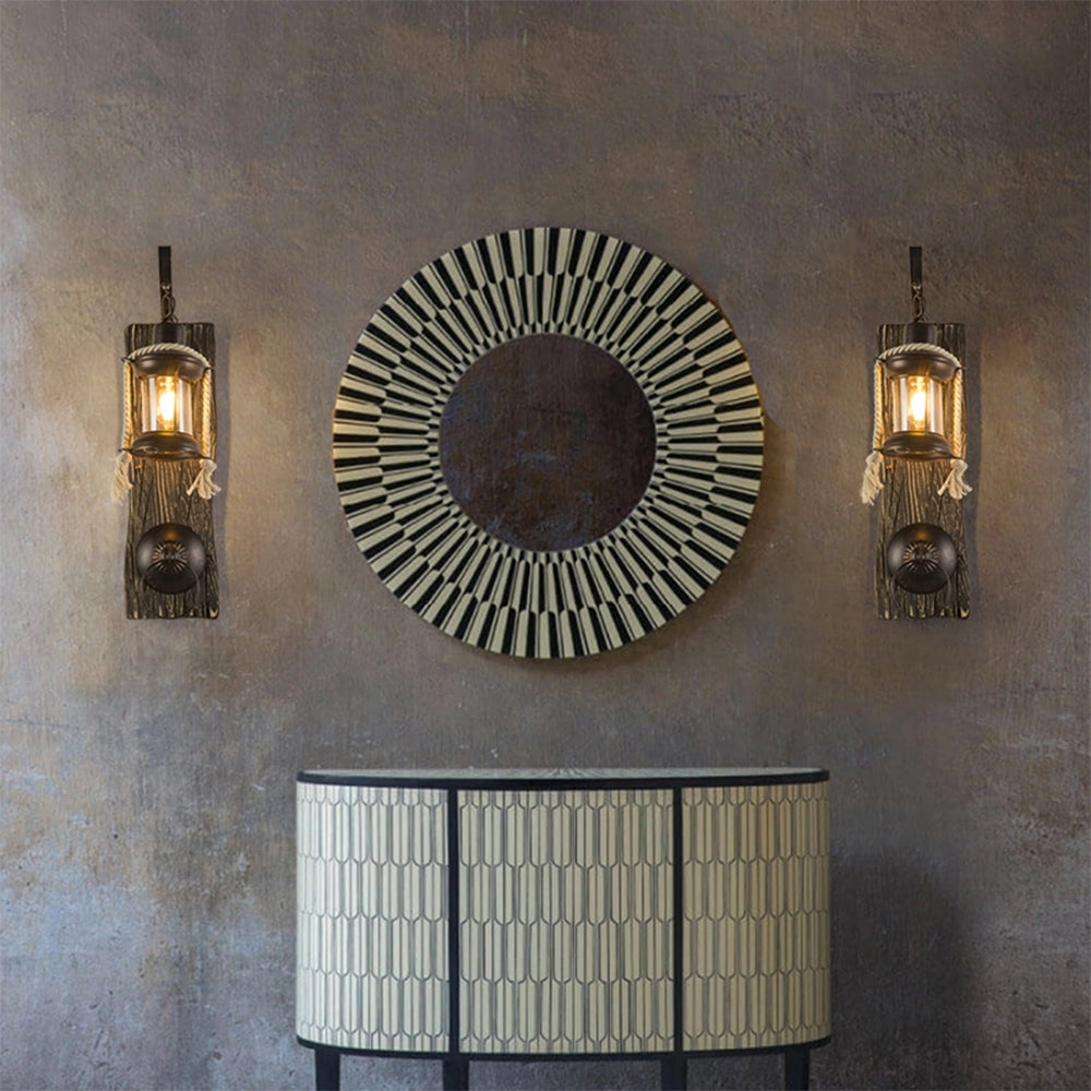 Rustic nautical lantern sconce with a vintage design, featuring a rectangular wooden frame and light shade, mounted on a wall within a coastal-themed interior setting.