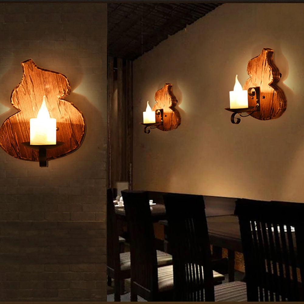 Rustic wall sconce made from pine wood featuring a vintage cello lamp design, with an amber glow suitable for interior lighting and decoration.