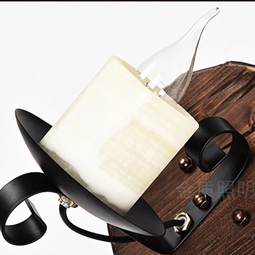 Rustic wall sconce featuring a wooden candle holder with a vintage cello lamp design.