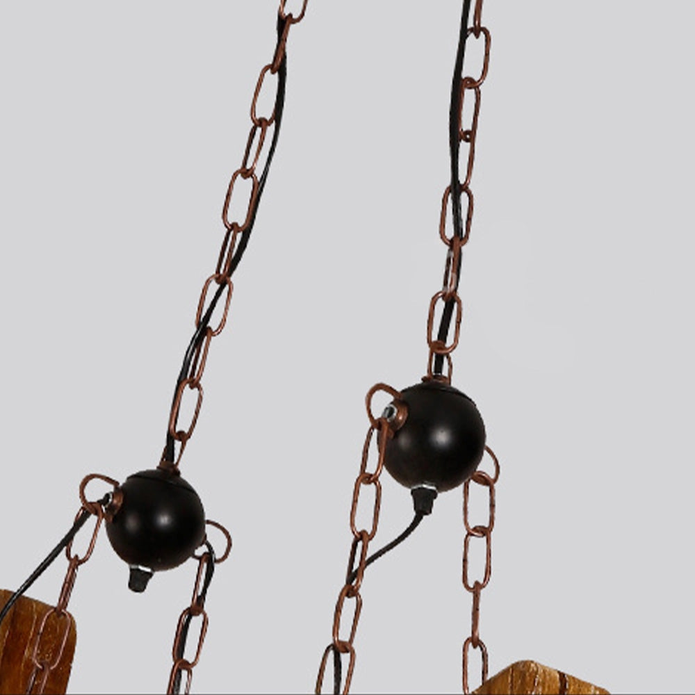 Rustic wooden wheel chandelier with a vintage farmhouse design, featuring a circular wood structure reminiscent of a traditional wagon wheel.