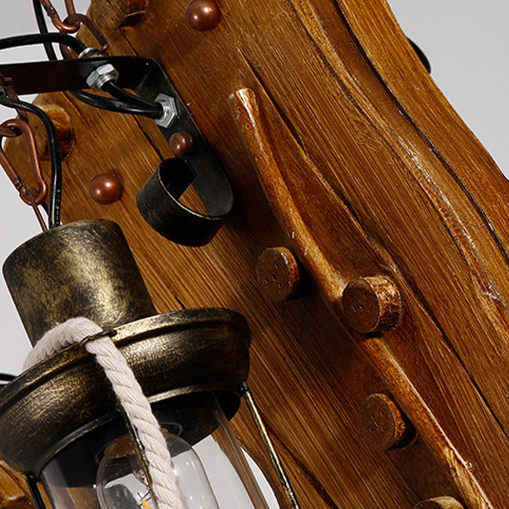 Rustic wooden wheel chandelier with a vintage farmhouse design, featuring a circular arrangement of wooden spokes and a metal frame, exuding a warm brown tone.