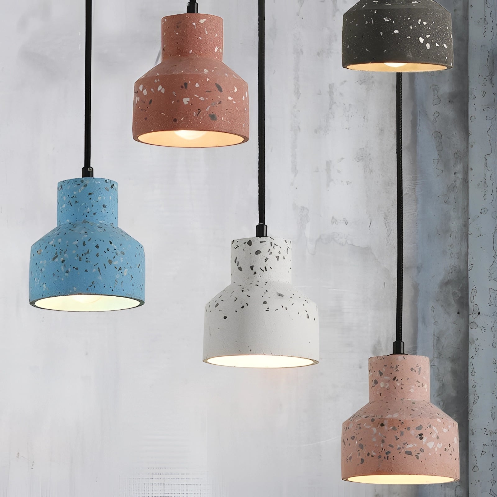 Scandinavian Terrazzo Pendant Light with a modern minimalist design, featuring a terrazzo finish and soft ambient lighting, hanging in a contemporary interior setting.