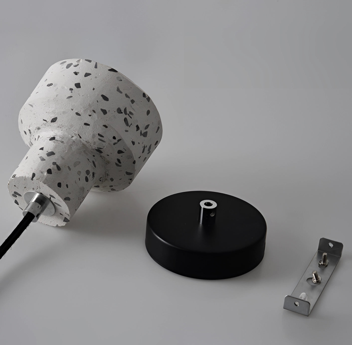 Scandinavian Terrazzo Pendant Light with a modern minimalist design, featuring a sleek metal construction and terrazzo detailing, hanging elegantly.