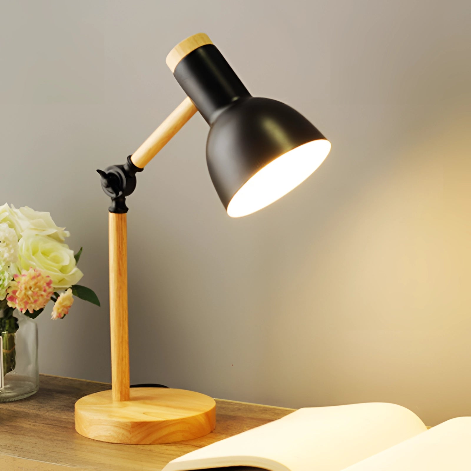 A stylish Scandinavian wooden adjustable LED desk lamp in retro style with a black finish, featuring three color settings and a switch, set against a background of vibrant orange and yellow tones.