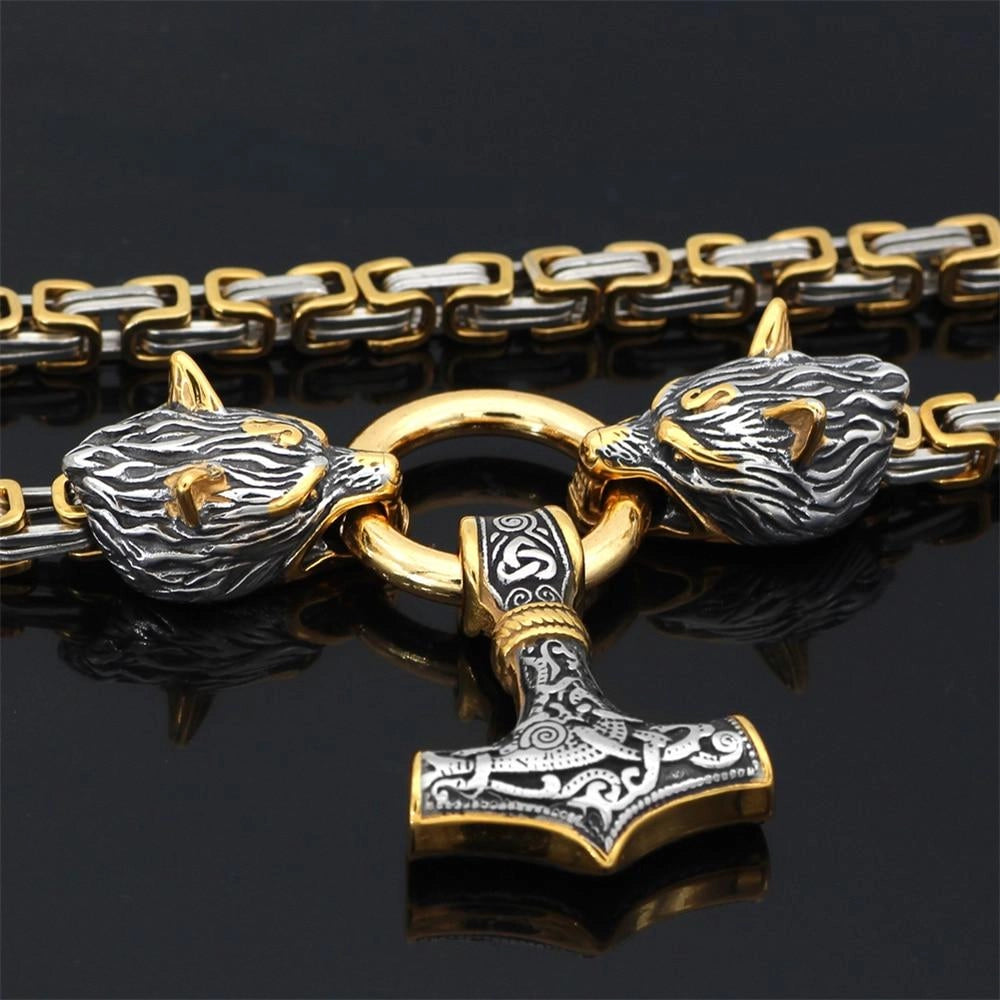 Silver Viking Wolf Head and Mjolnir Pendant featuring intricate Norse designs, crafted in metal, serving as a bold fashion accessory and symbol of strength and heritage.