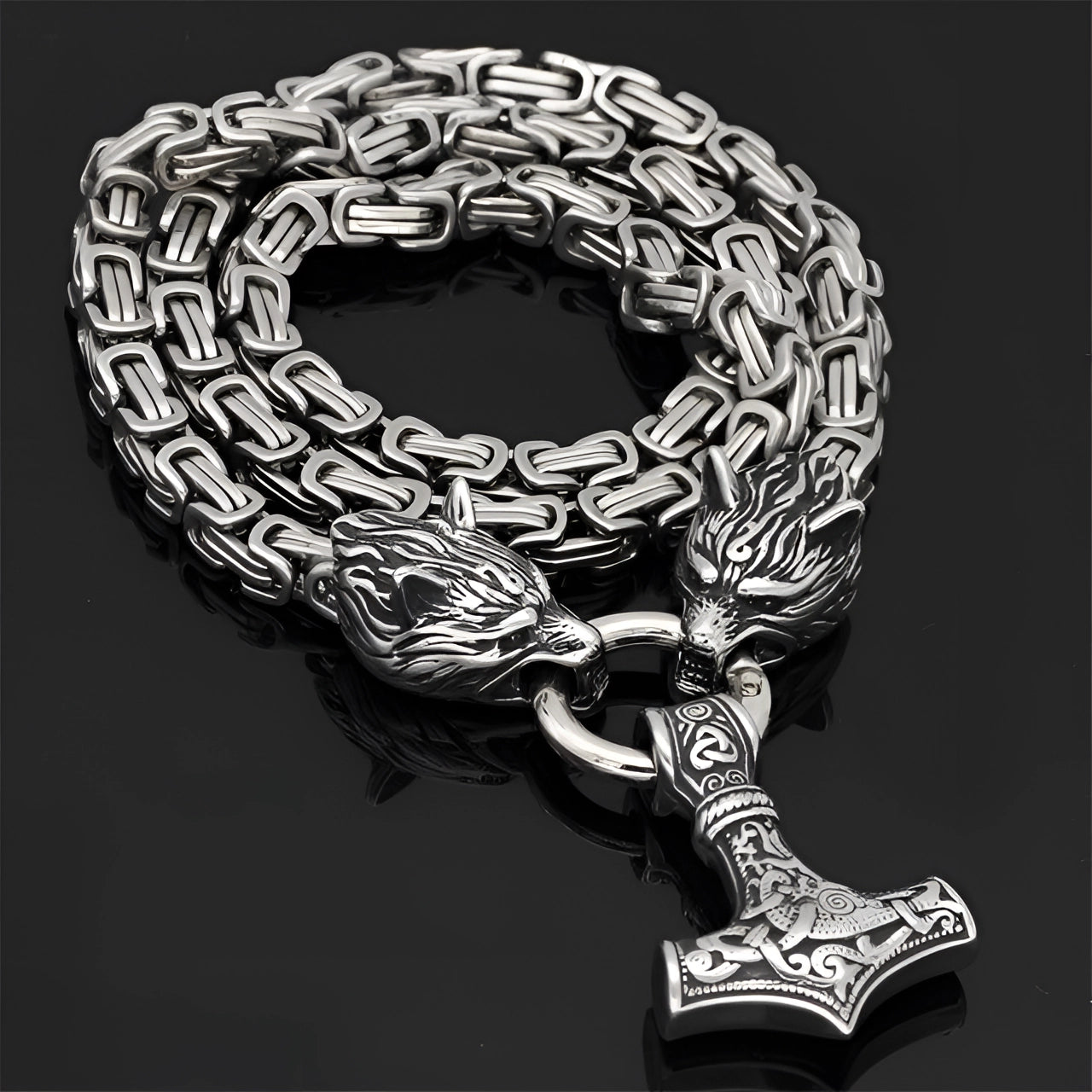 Silver Viking Wolf Head and Mjolnir pendant made entirely of silver steel, featuring intricate Norse design elements, with a wolf head and Thor's hammer motif on a 90 cm chain.