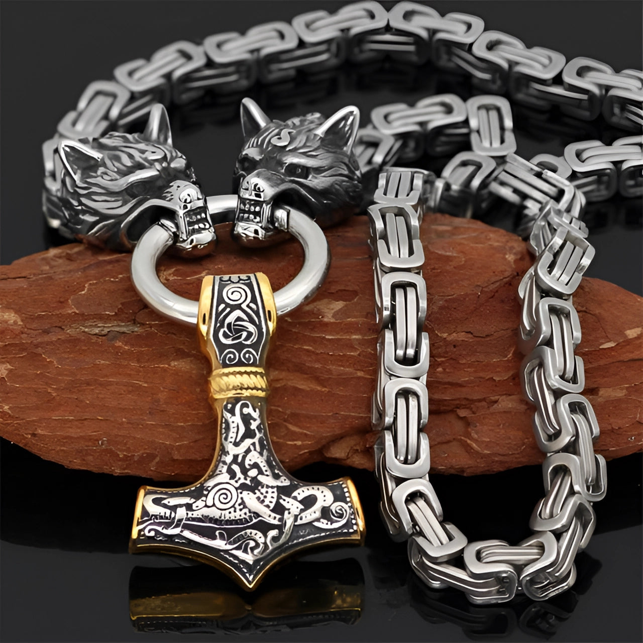Silver Viking Wolf Head and Mjolnir pendant with intricate details, combining silver and gold finishes, attached to a 90 cm chain; designed as masculine Norse-inspired jewelry featuring a symbolic representation of strength and heritage.