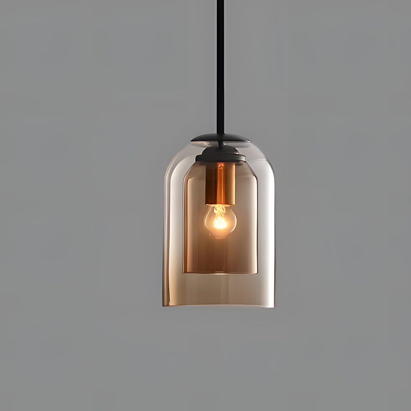 Modern smoke glass pendant light featuring a transparent Edison bulb and rust-colored metal accents, designed for ceiling installation.