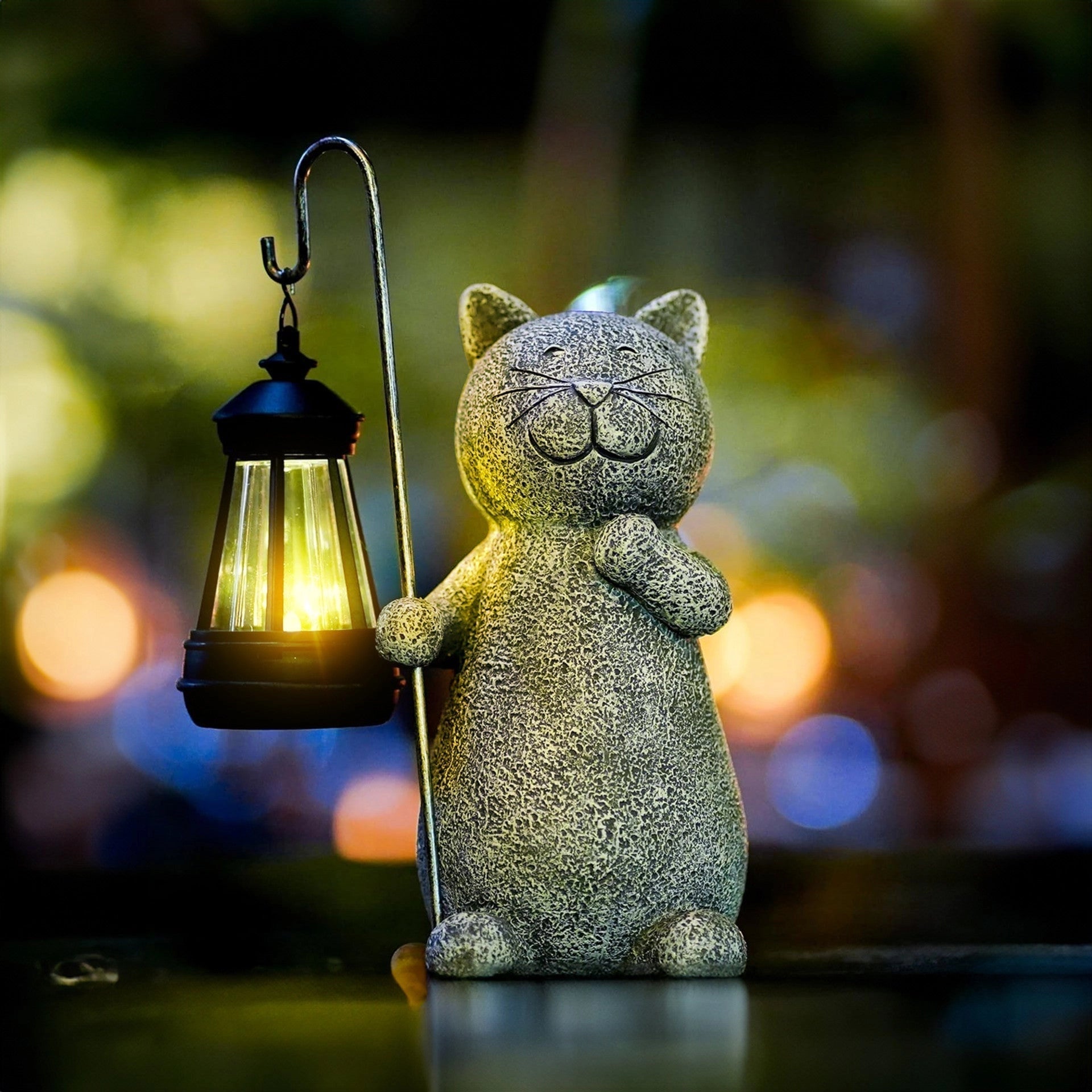 Whimsical cat-shaped solar lantern sculpture for garden decor, featuring eco-friendly design with intricate whiskers detail, displayed outdoors against a clear sky.