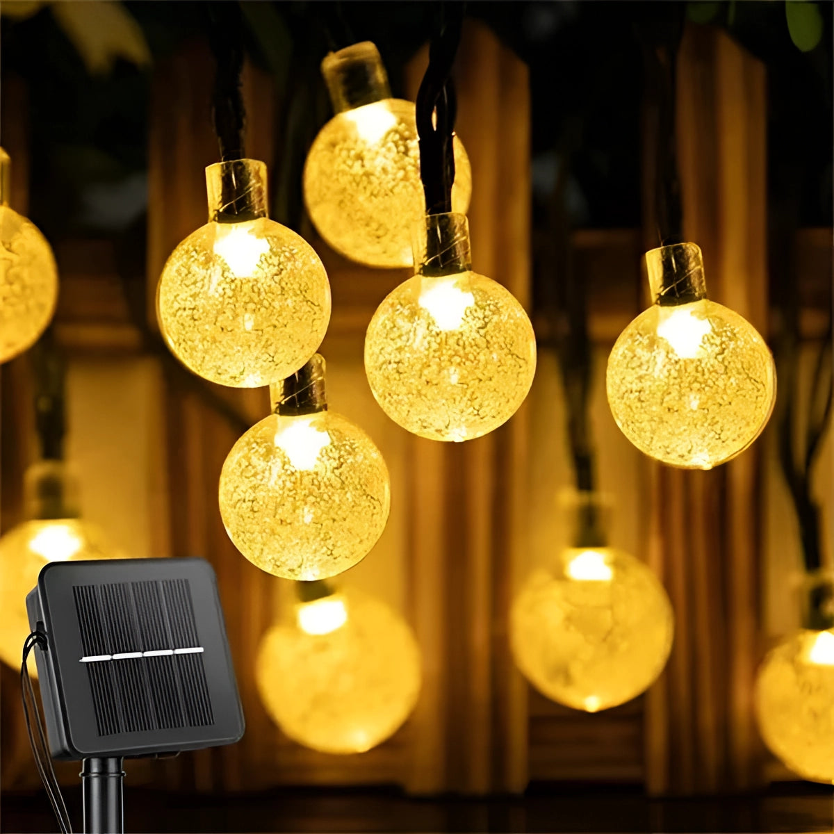 Solar Crackled Glass Globe Lights with warm white LED bulbs strung on a 75-foot cord featuring 200 round, crackled glass globes emitting a soft amber glow, designed for outdoor use and waterproof, illuminating a space with an elegant, warm ambiance.