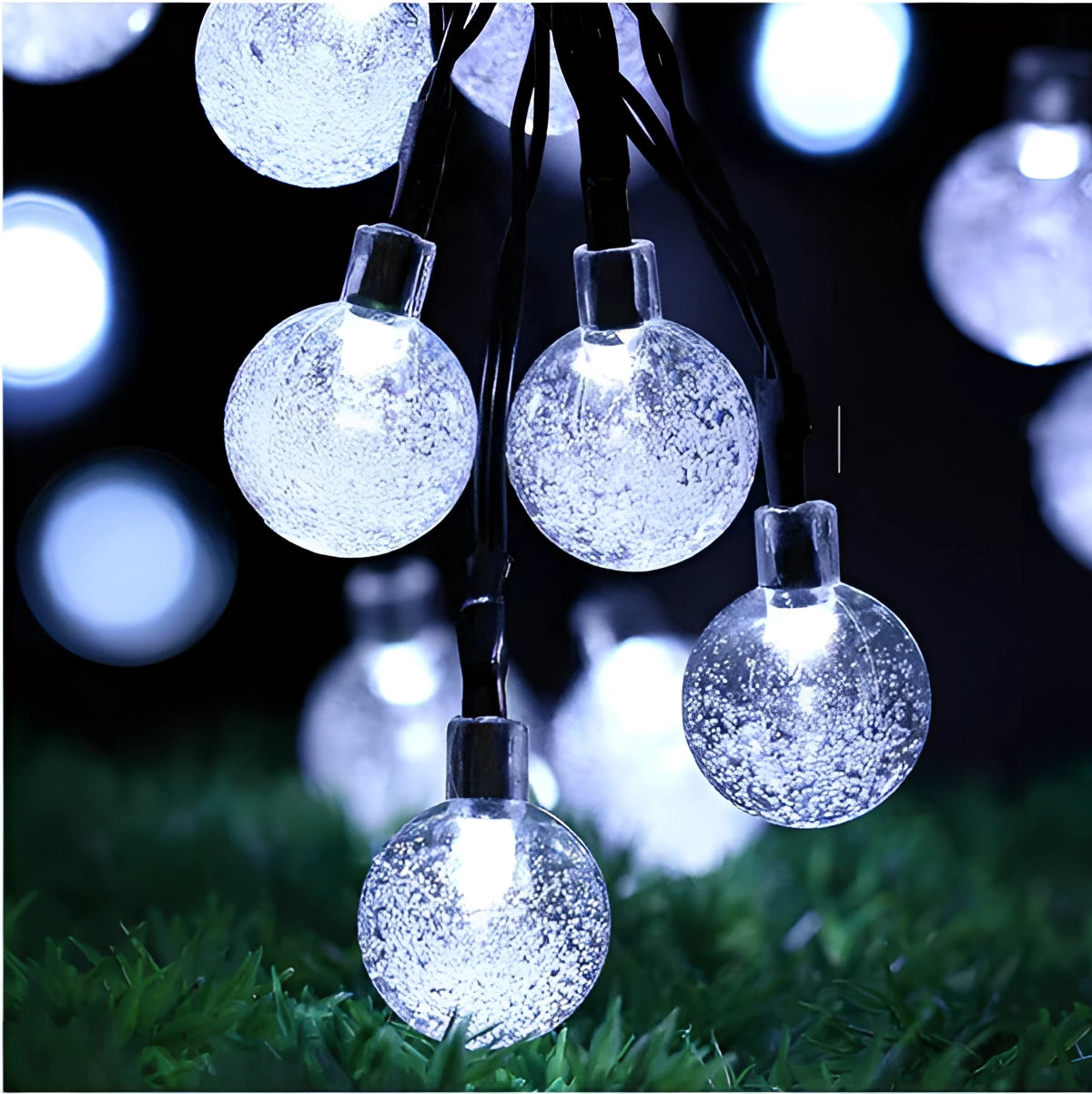 Solar crackled glass globe lights with cool white LED bulbs on a 75-foot waterproof cord featuring 200 illuminated orbs, ideal for outdoor decoration and adding festive charm to gardens or patios.